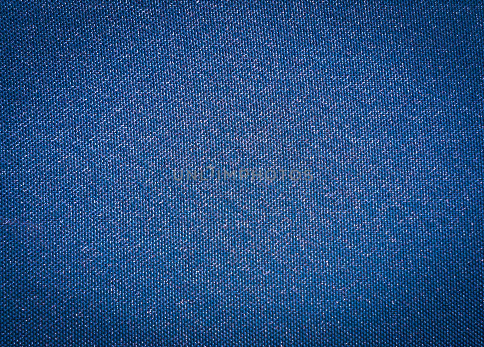 Texture of a blue woven synthetic waterproof fabric