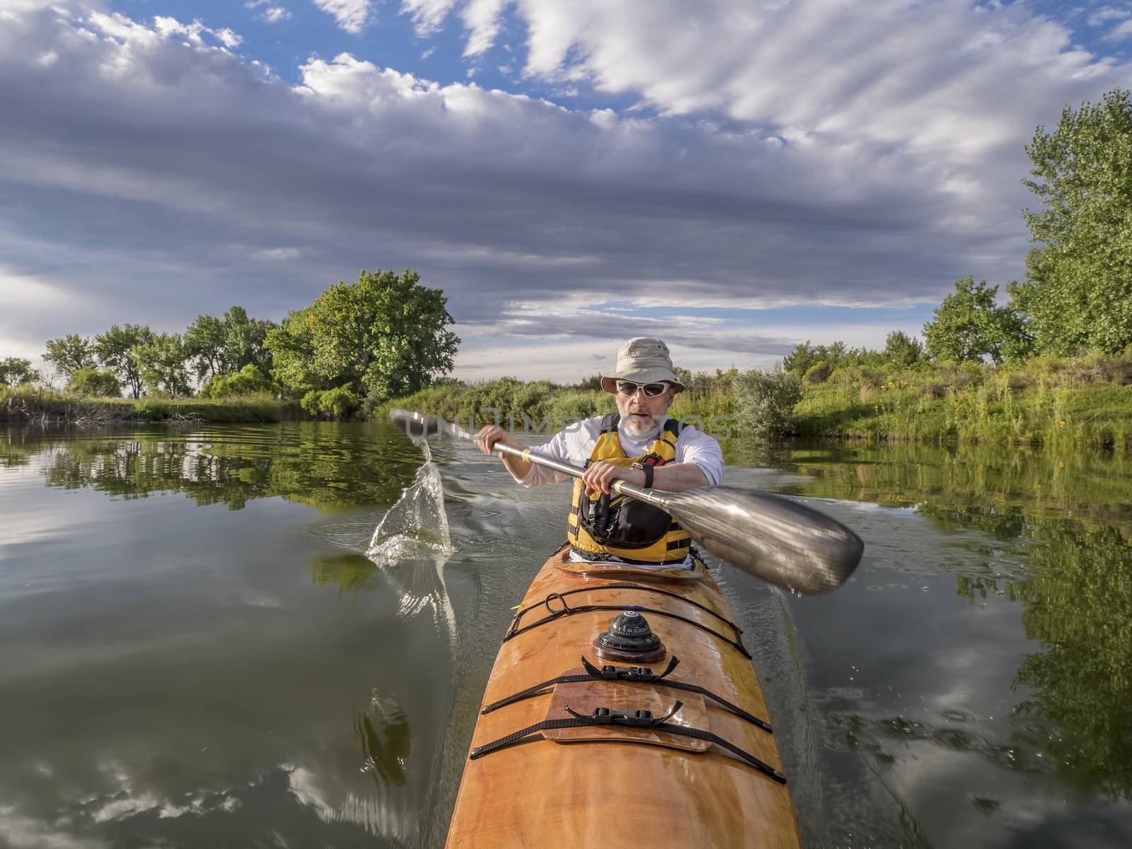 paddling sea kayak by PixelsAway