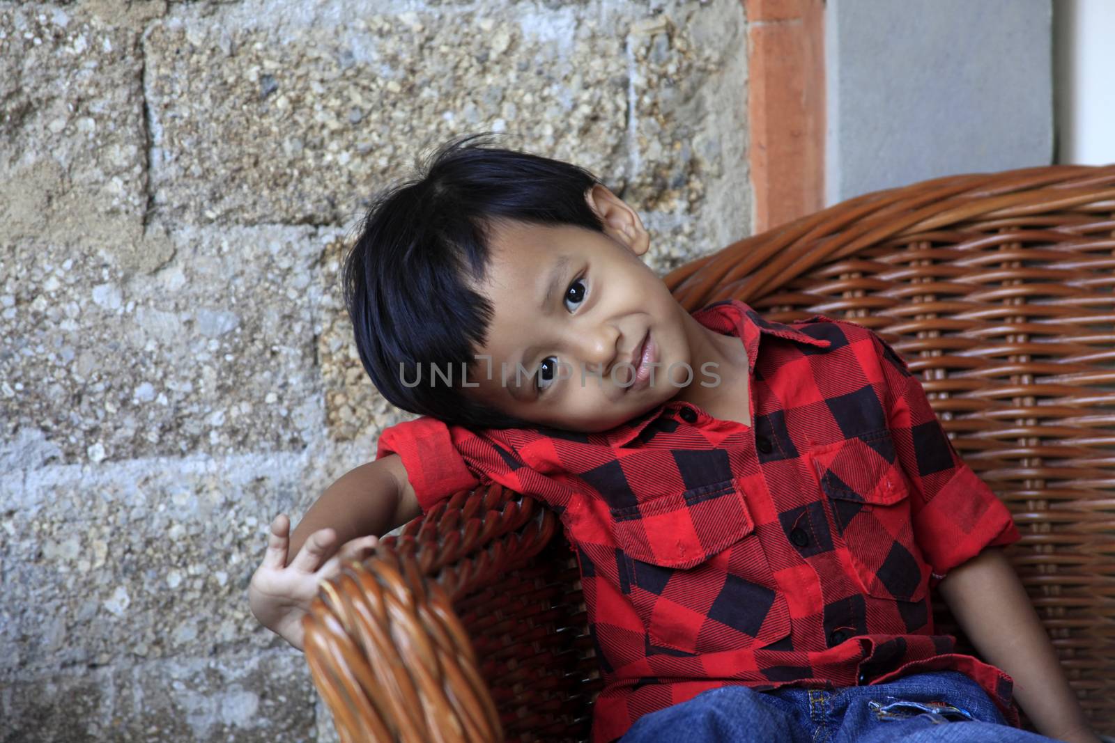 Photo of handsome asian boy with smiling. Indonesia, Bali
