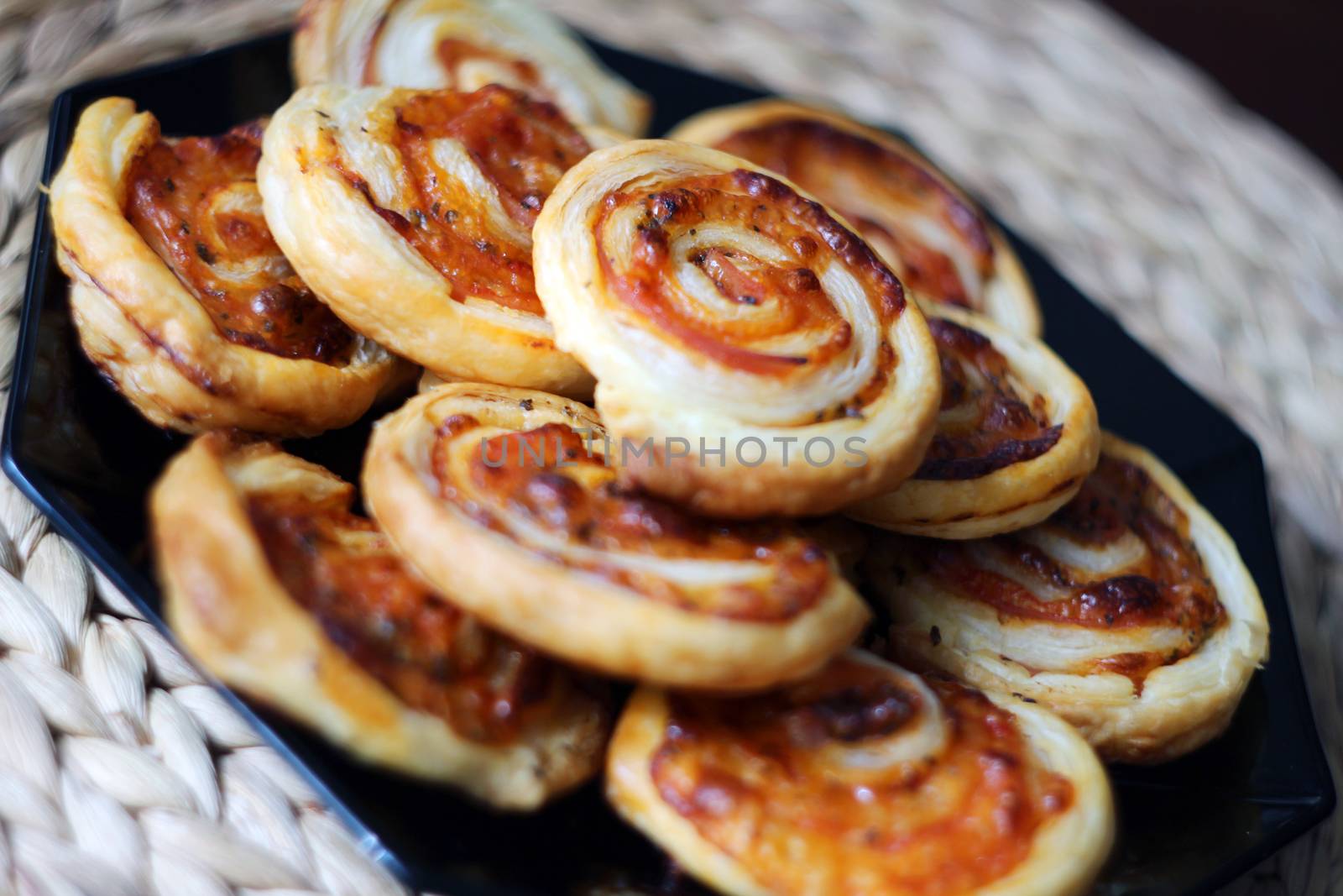 Dry spiral puff pastry as small pizzas