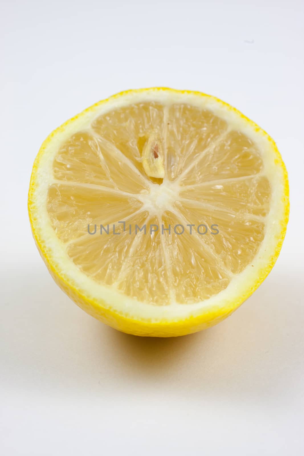 Fresh lemons on a white background.