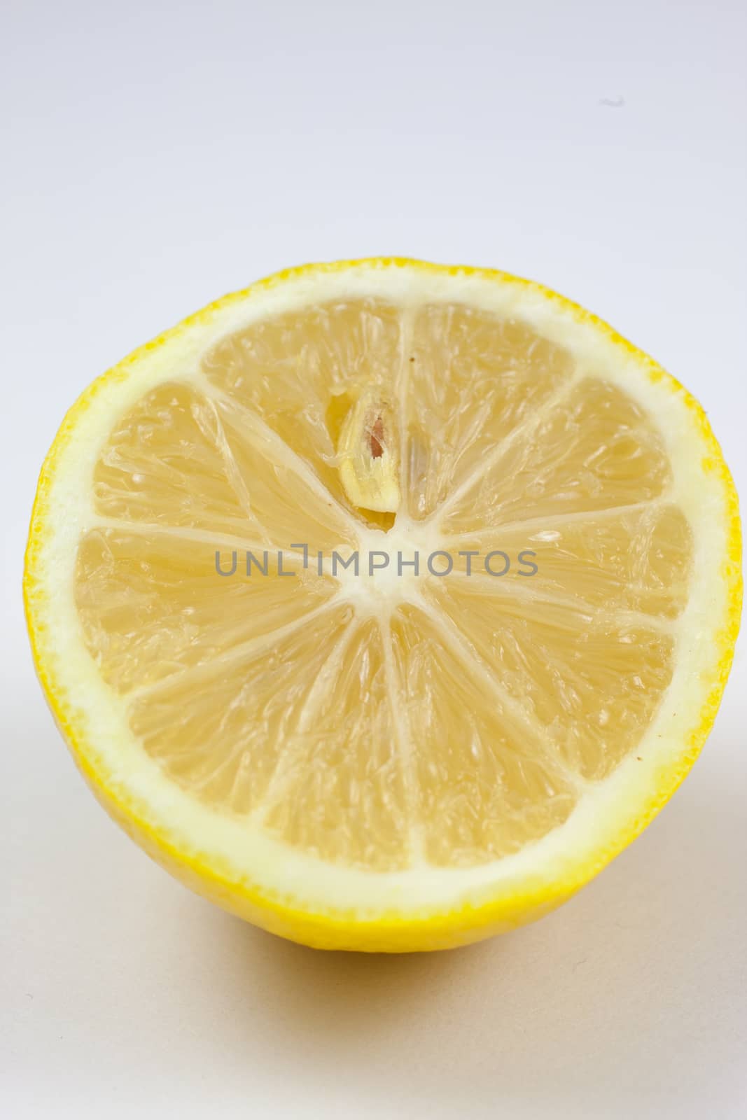 Fresh lemons on a white background.