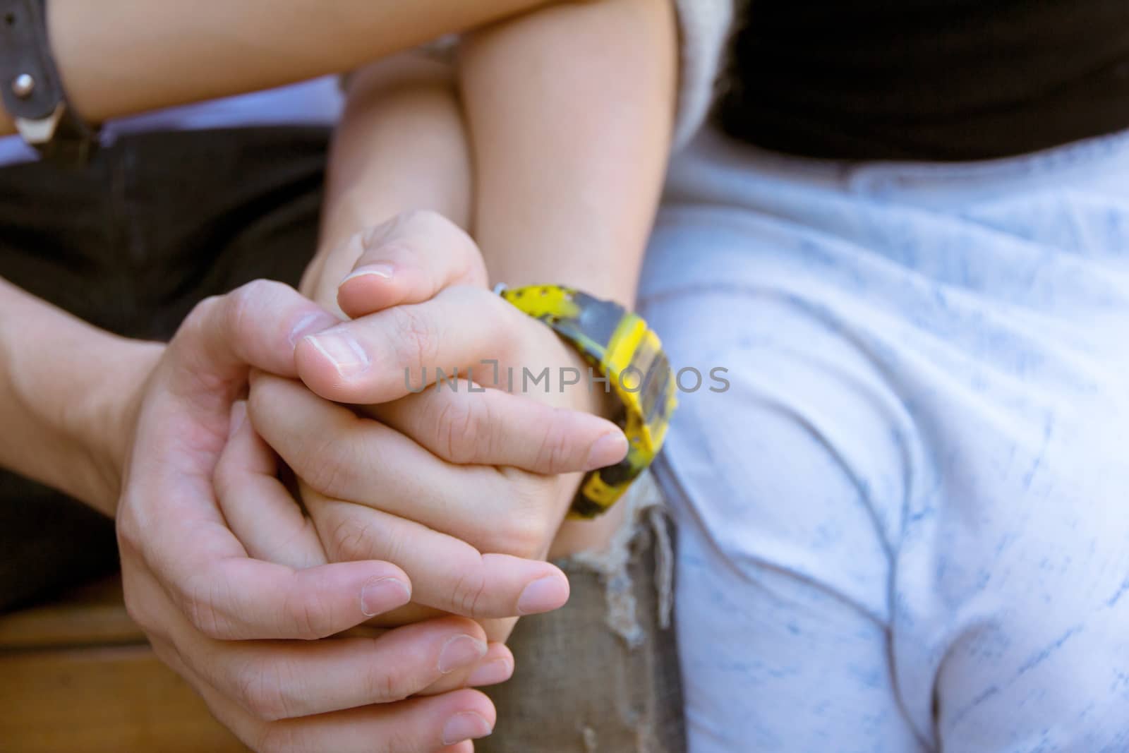 young couple holding hands
