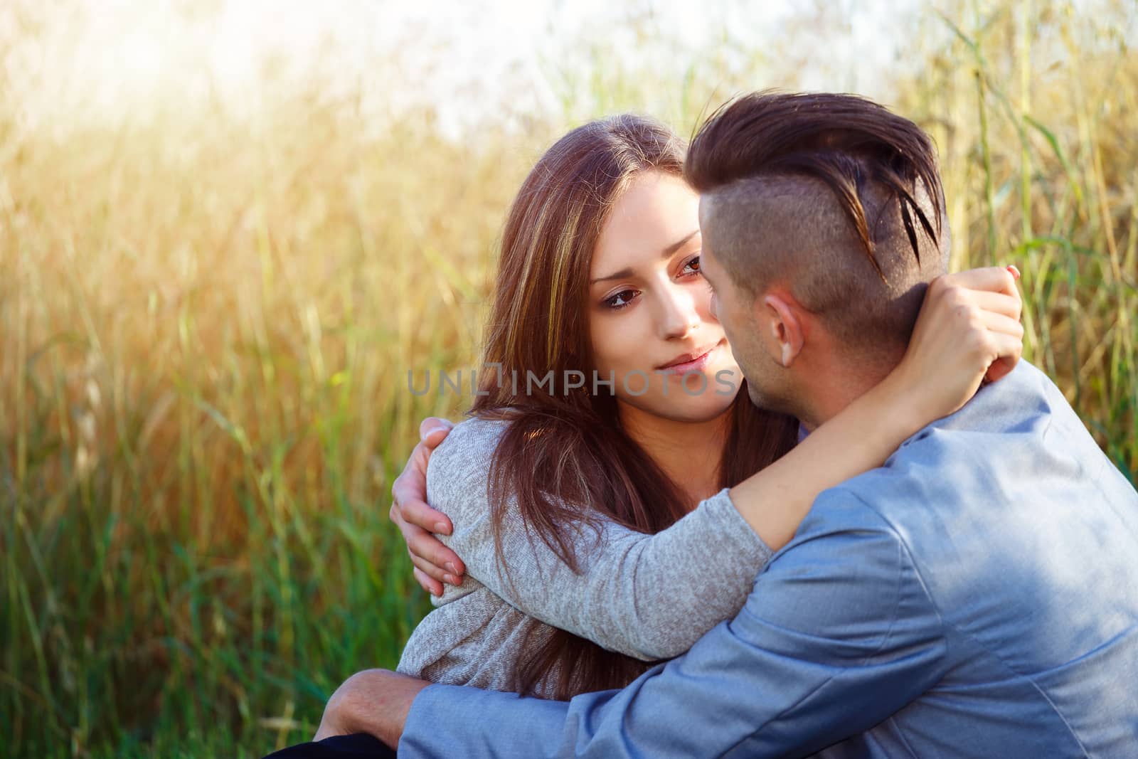 Happy smiling young couple outdoor by artush