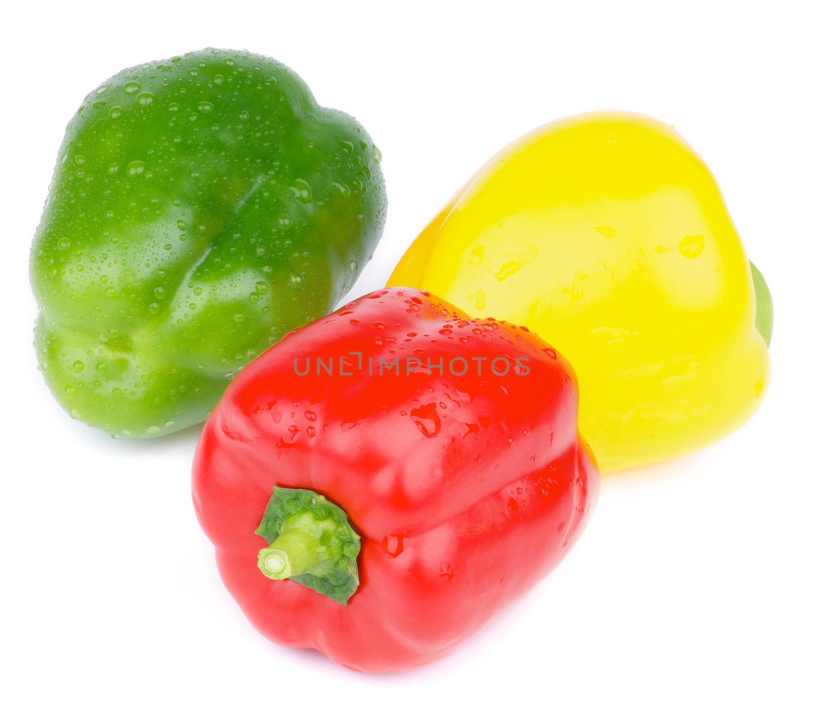 Ripe Fresh Wet Red, Green and Yellow Bell Peppers isolated on white background