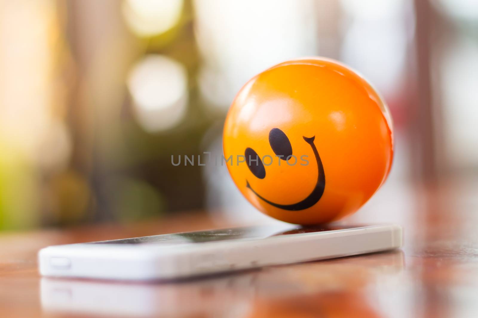 smiling ball with moblie  phone by nitimongkolchai