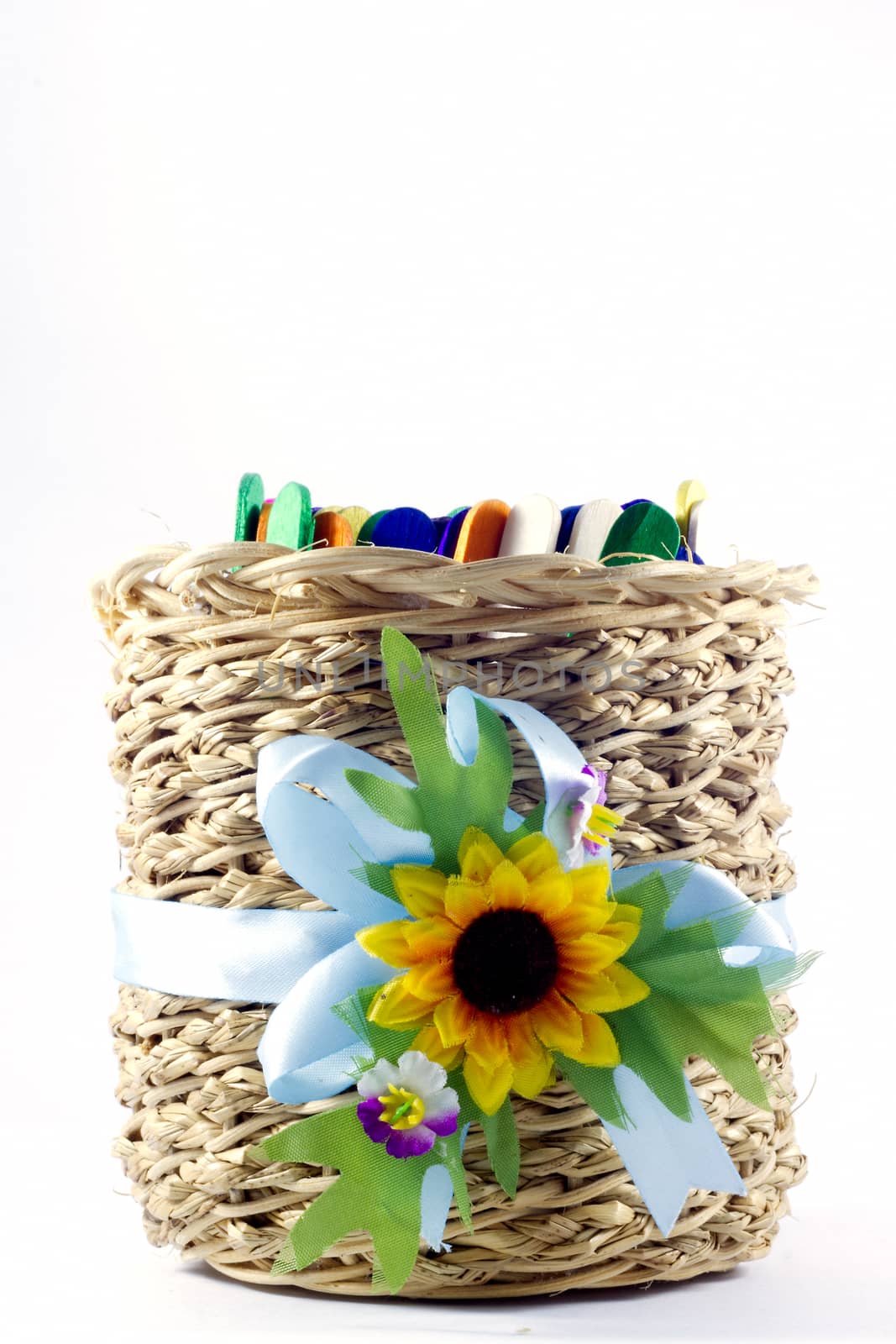 cylindrical wicker basket made hand  with ice strick inside on white background