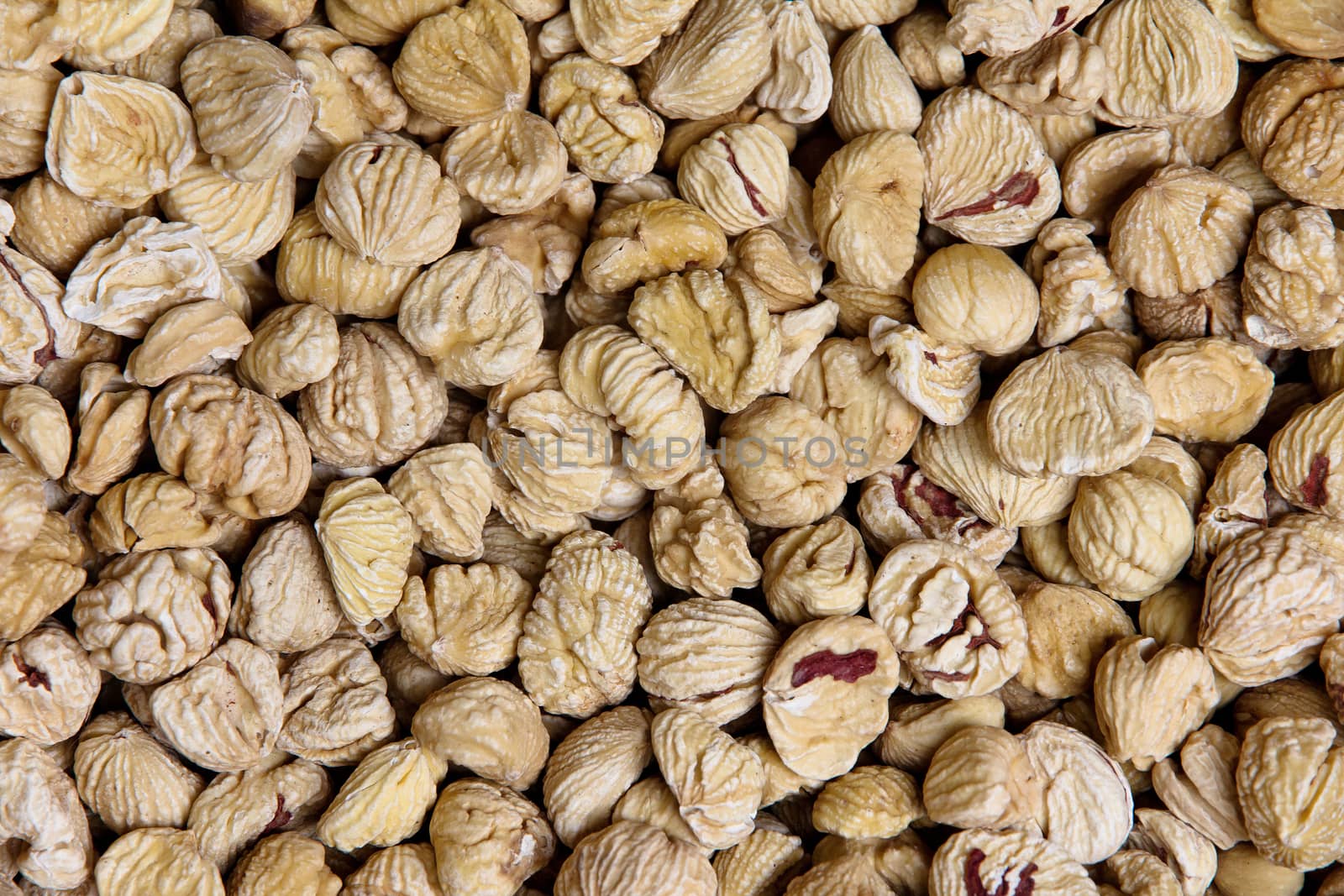 Background of peeled dried chestnuts