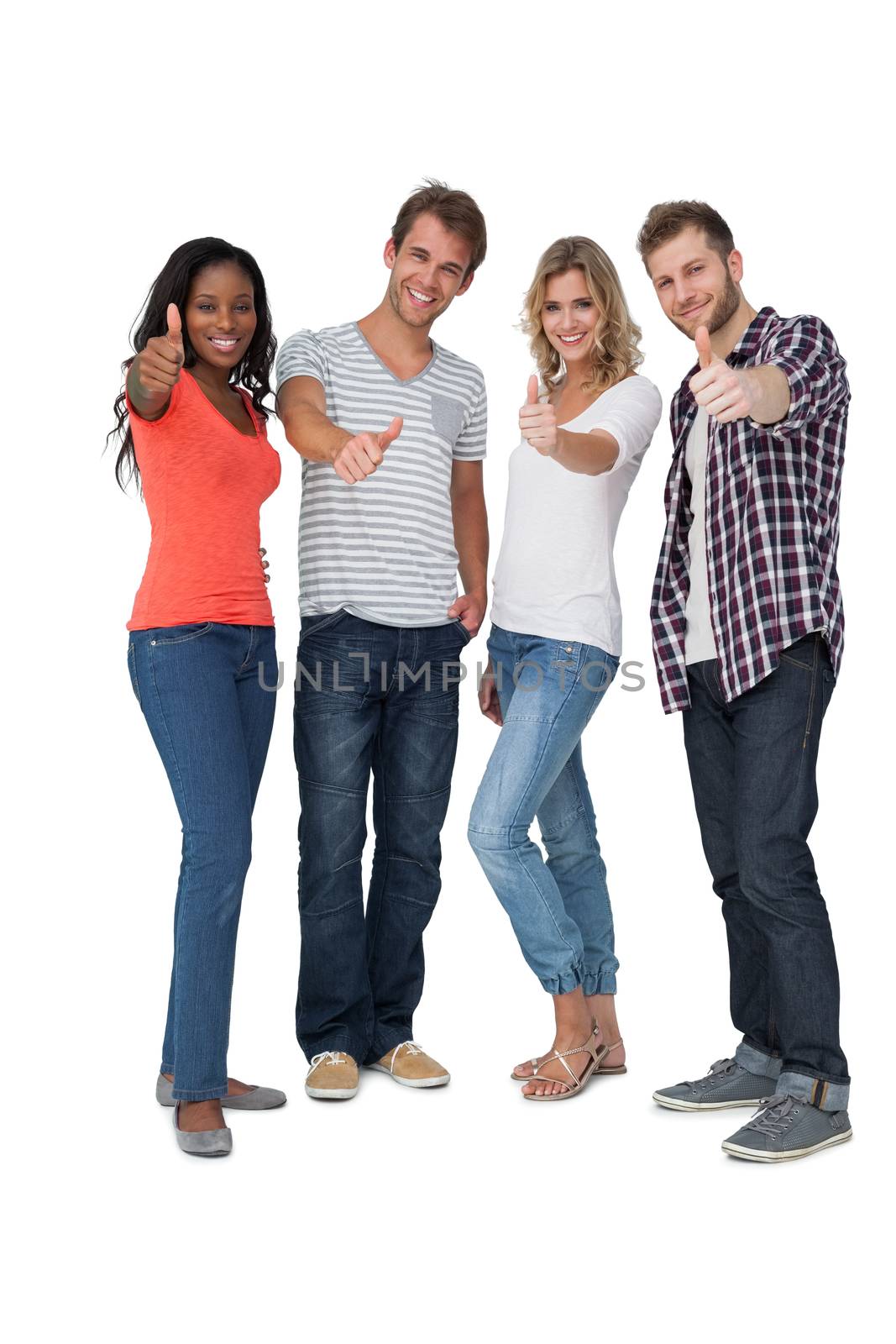 Full length of casually dressed young people gesturing thumbs up over white background