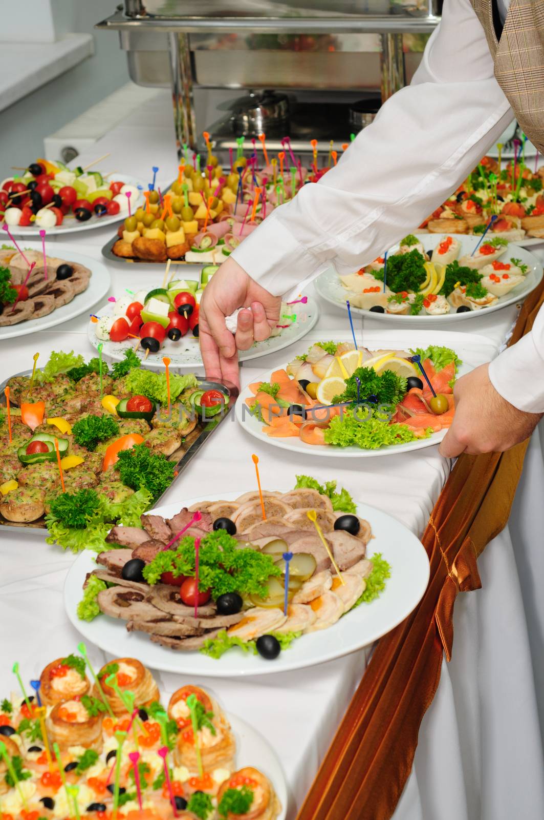 luxury served banquet table with canap��s and chafing dishes