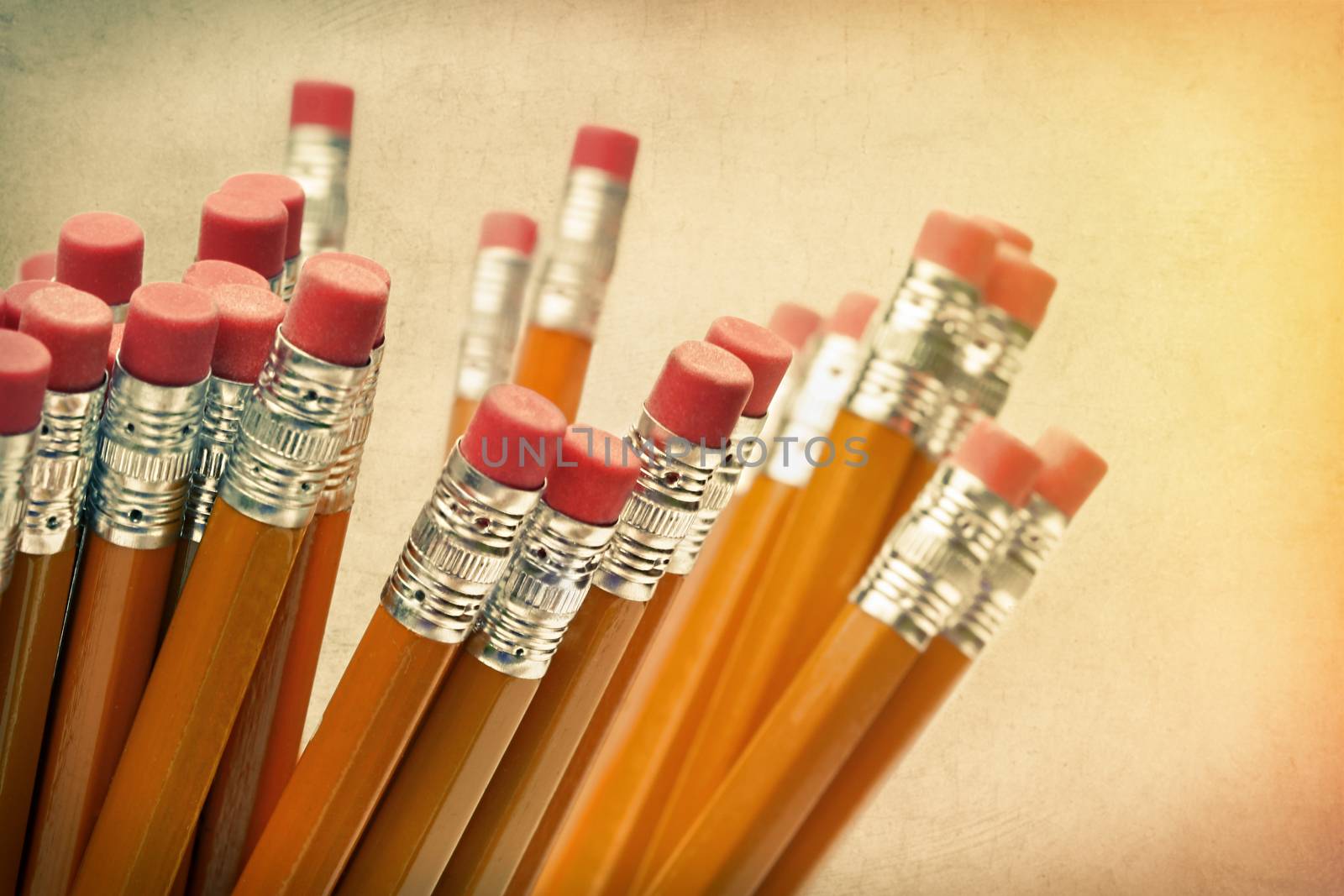 Lead pencils against a vintage paper background