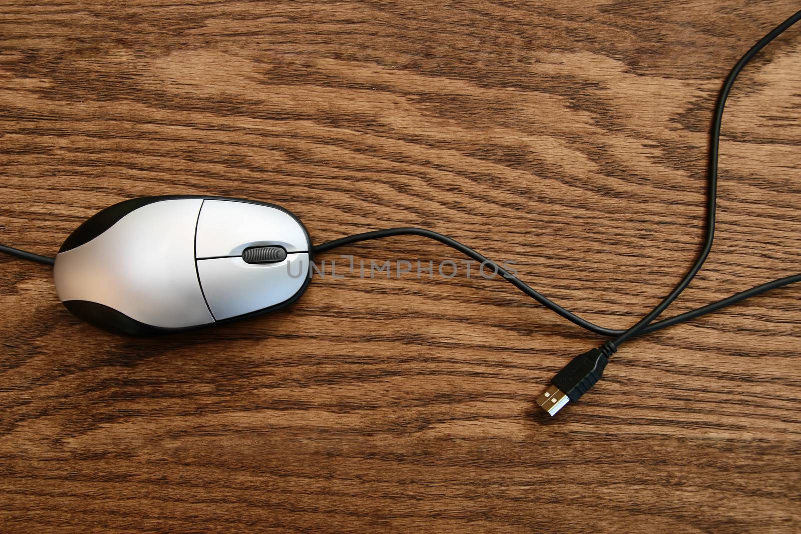 Computer mouse on wooden surface by Sandralise