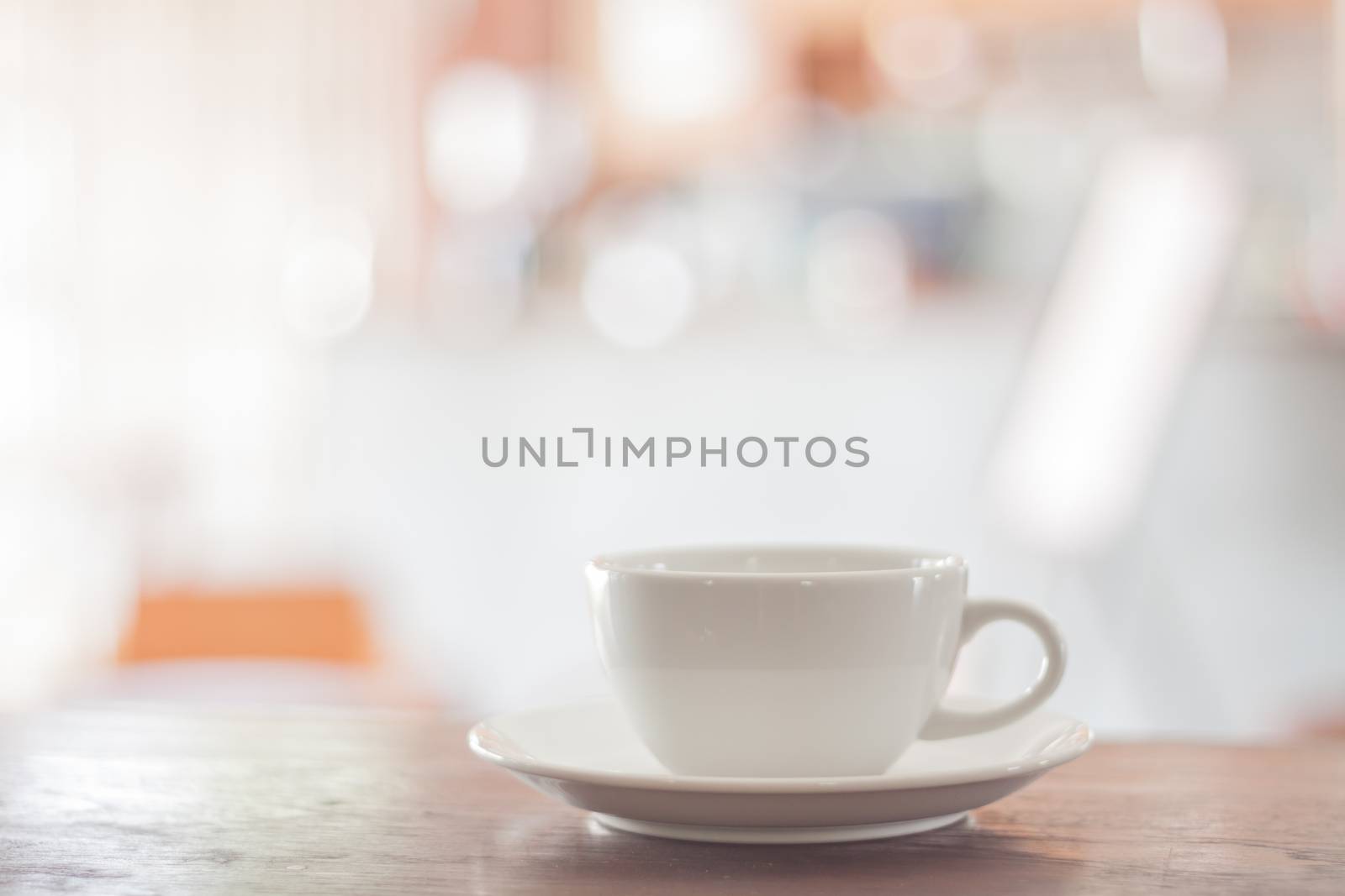 White coffee cup on wooden table, stock photo