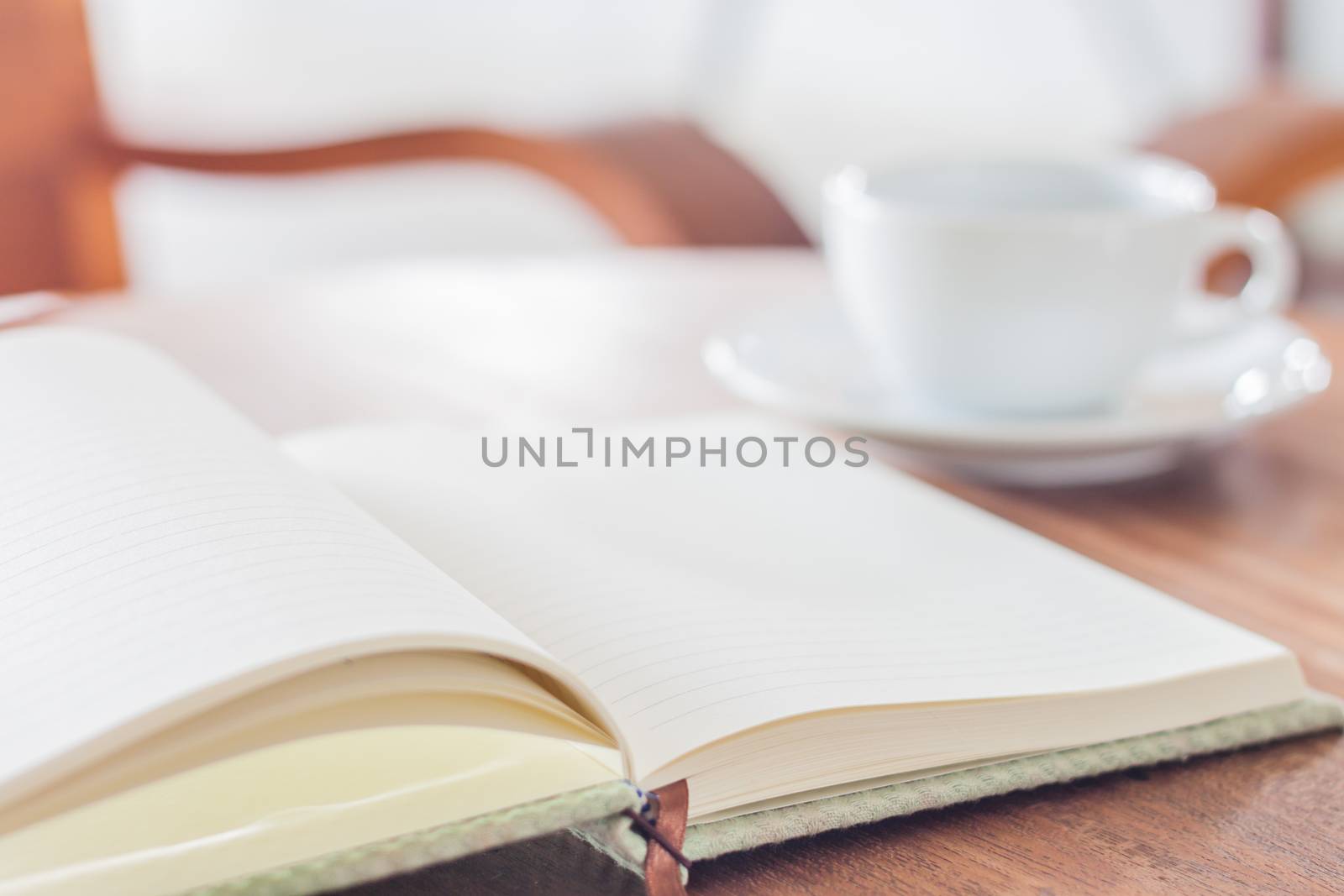 Blank notebook with coffee cup by punsayaporn
