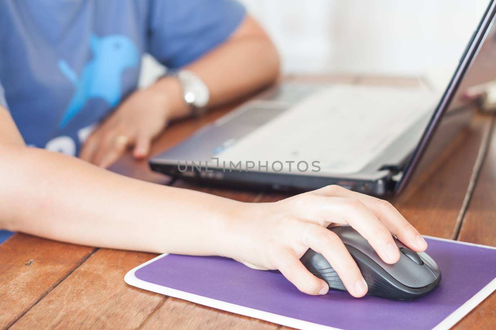 Woman working with laptop, stock photo