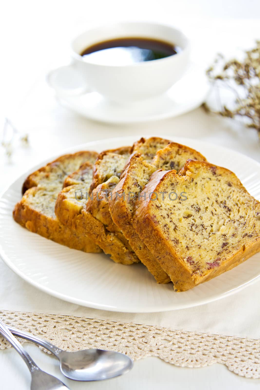 Homemade Banana cake by a cup of cofee