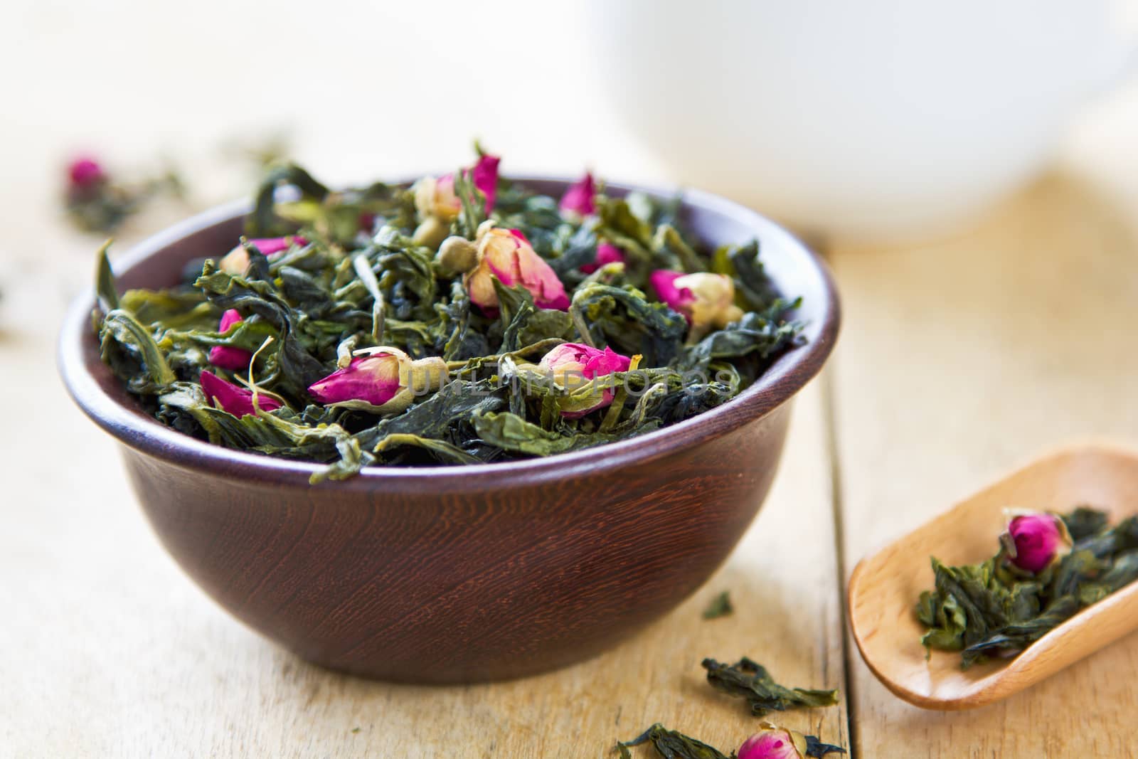 Green tea leaves with rose buds by vanillaechoes