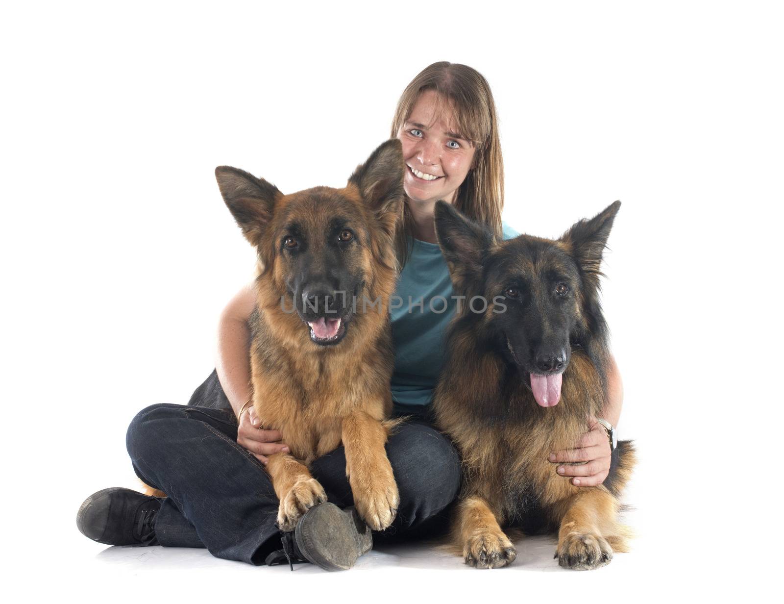 woman and dogs in front of white background