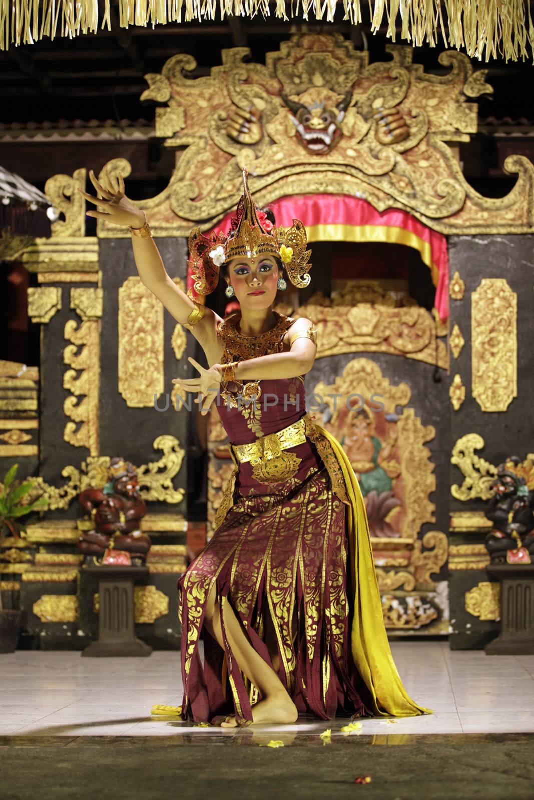 BALI, JIMBARAN, INDONESIA - 23 JULY, 2012:  Portrait of dancing girl in national clothes. Traditional daily representation in Jimbaran to Bali 23 July 2012, Indonesia