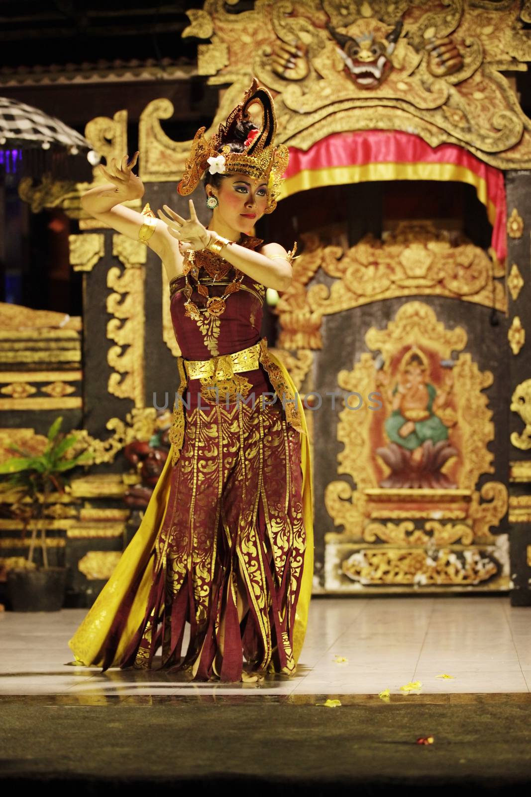 BALI, JIMBARAN, INDONESIA - 23 JULY, 2012:  Portrait of dancing girl in national clothes. Traditional daily representation in Jimbaran to Bali 23 July 2012, Indonesia