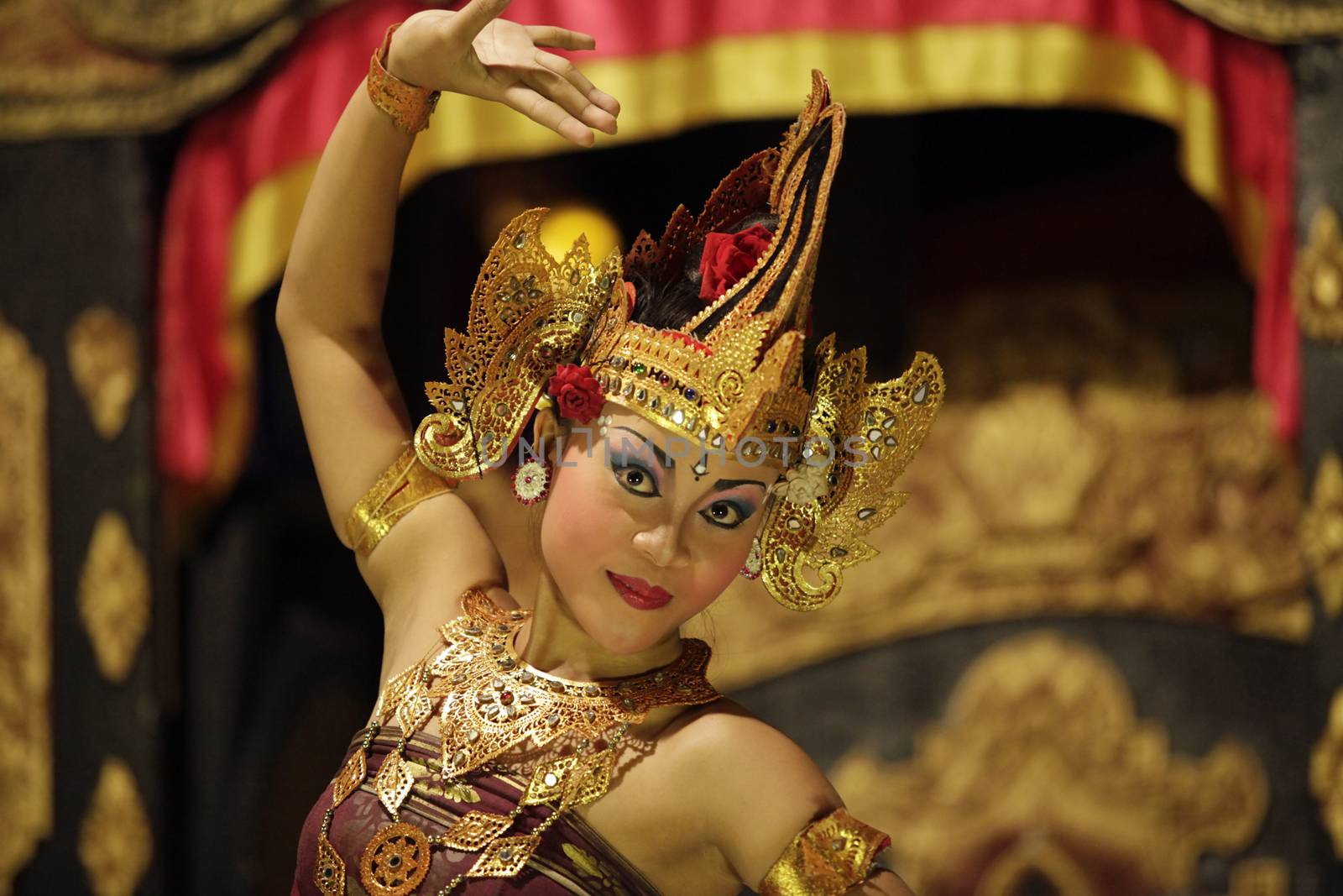 BALI, JIMBARAN, INDONESIA - 23 JULY, 2012:  Portrait of dancing girl in national clothes. Traditional daily representation in Jimbaran to Bali 23 July 2012, Indonesia
