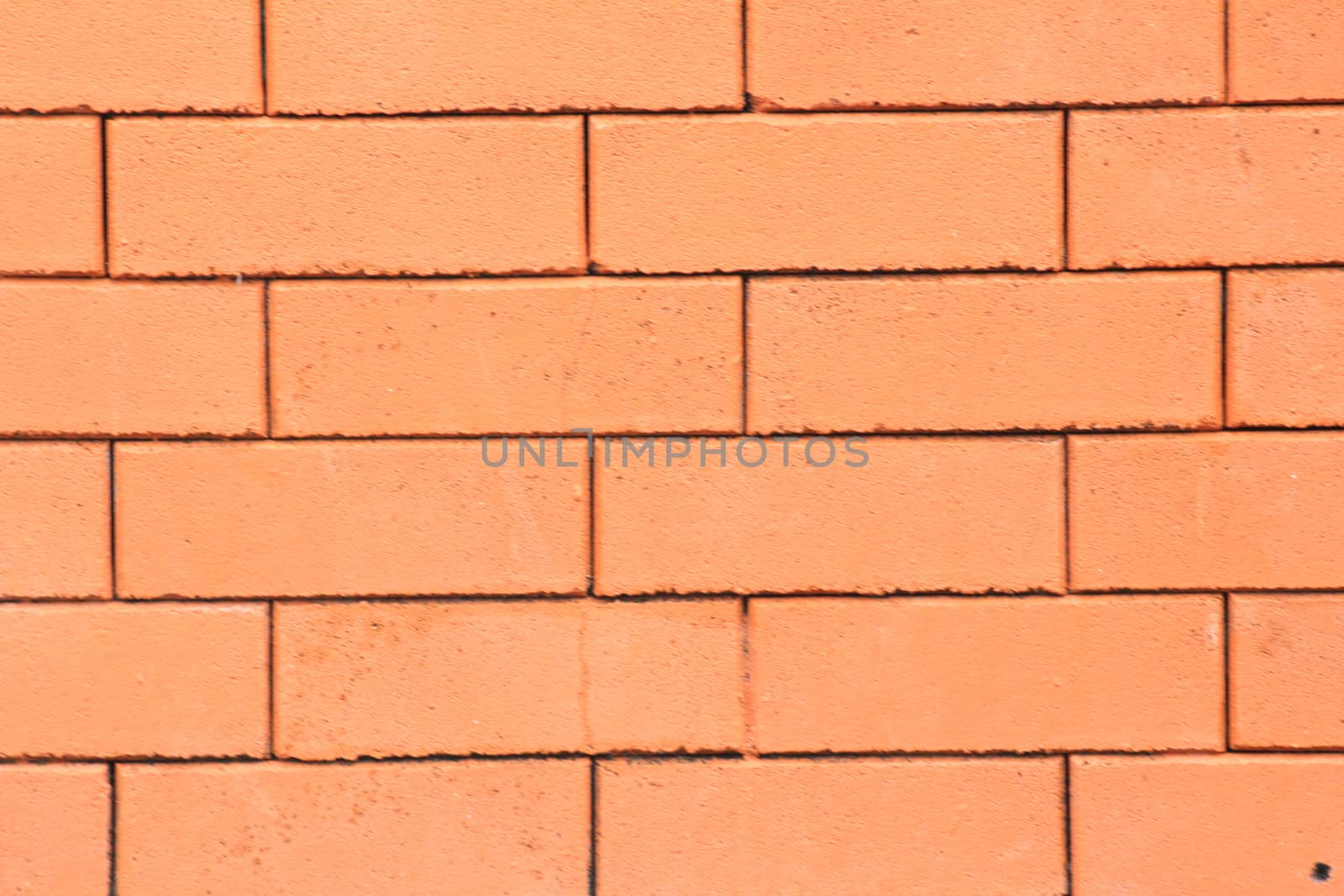 There is the brick wall have colour of orange.