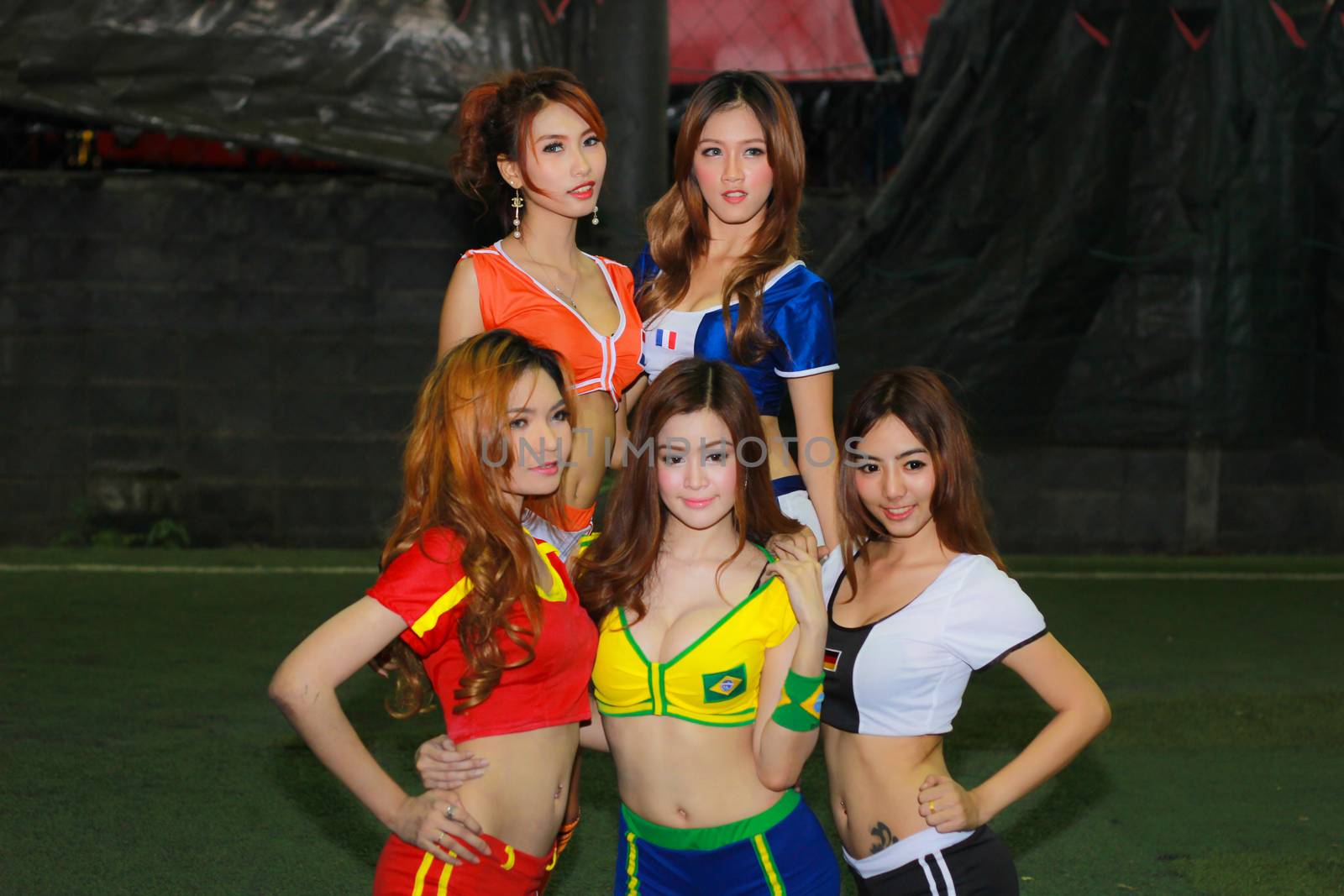 BANGKOK, THAILAND - JUNE 29, 2014: Unidentified model with Football costume pose for promote World Cup 2014 in futsal park on June 29, 2014 in Bangkok, Thailand.