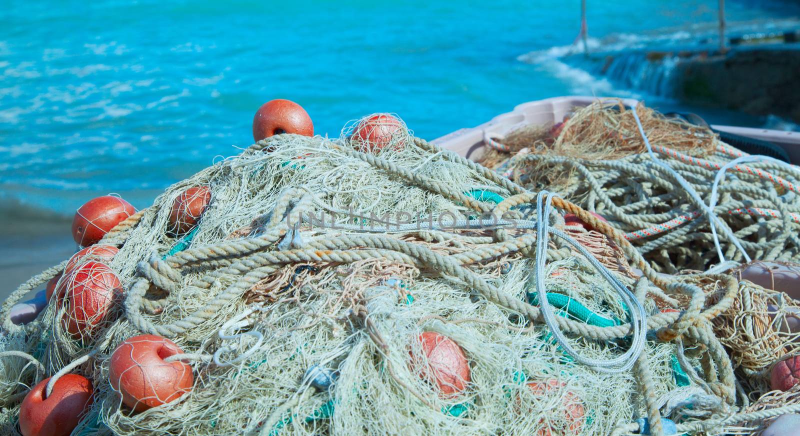 Fishnets massed on the edge of the sea