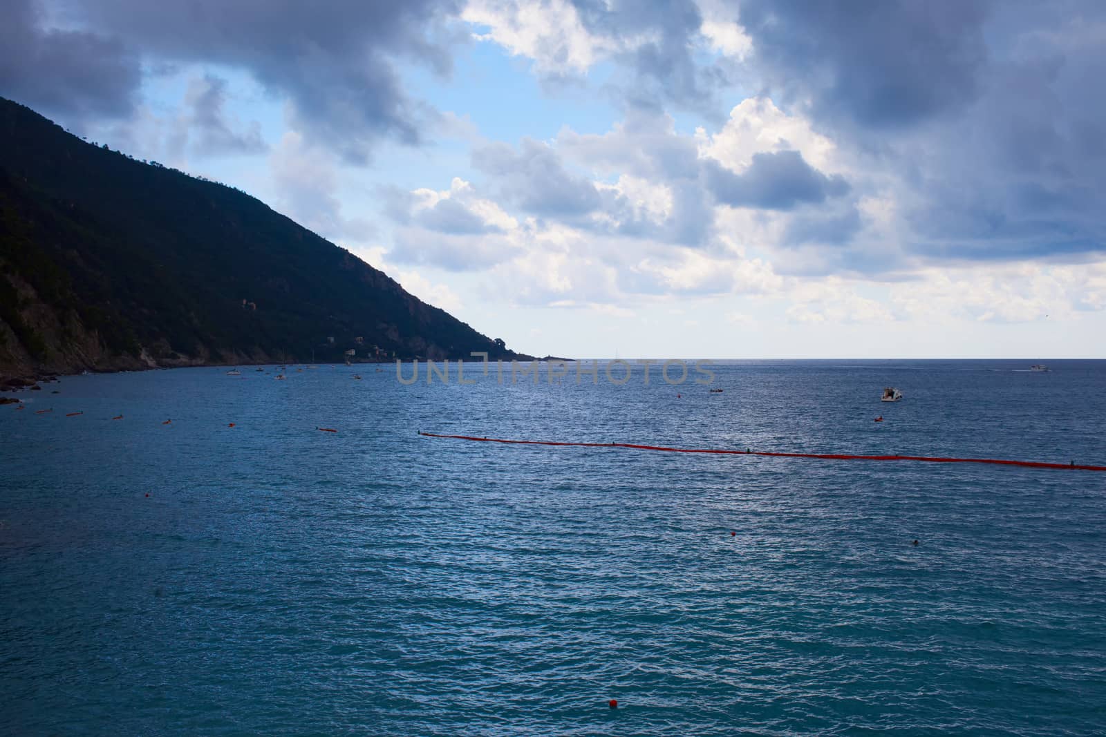 Sea under a blue and cloudy sky