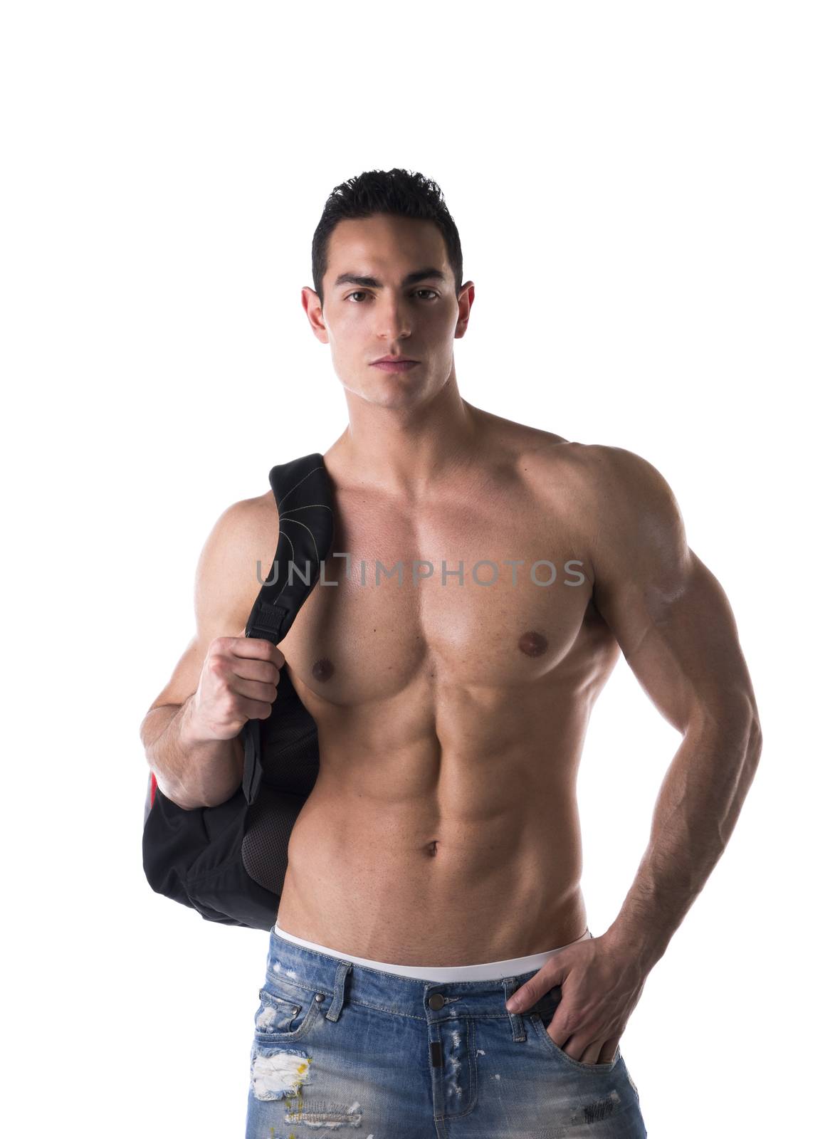 Shirtless muscular young man with backpack on his back, looking at camera, isolated on white