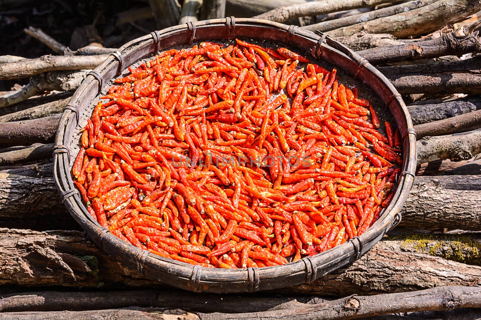 Chili dried in the bamboo basket by NuwatPhoto