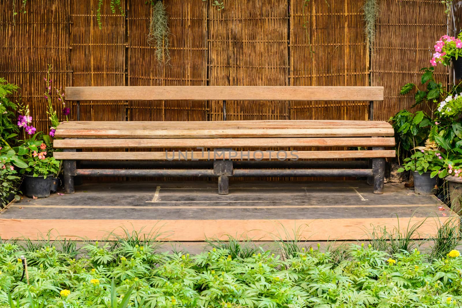 Wooden long bench by NuwatPhoto