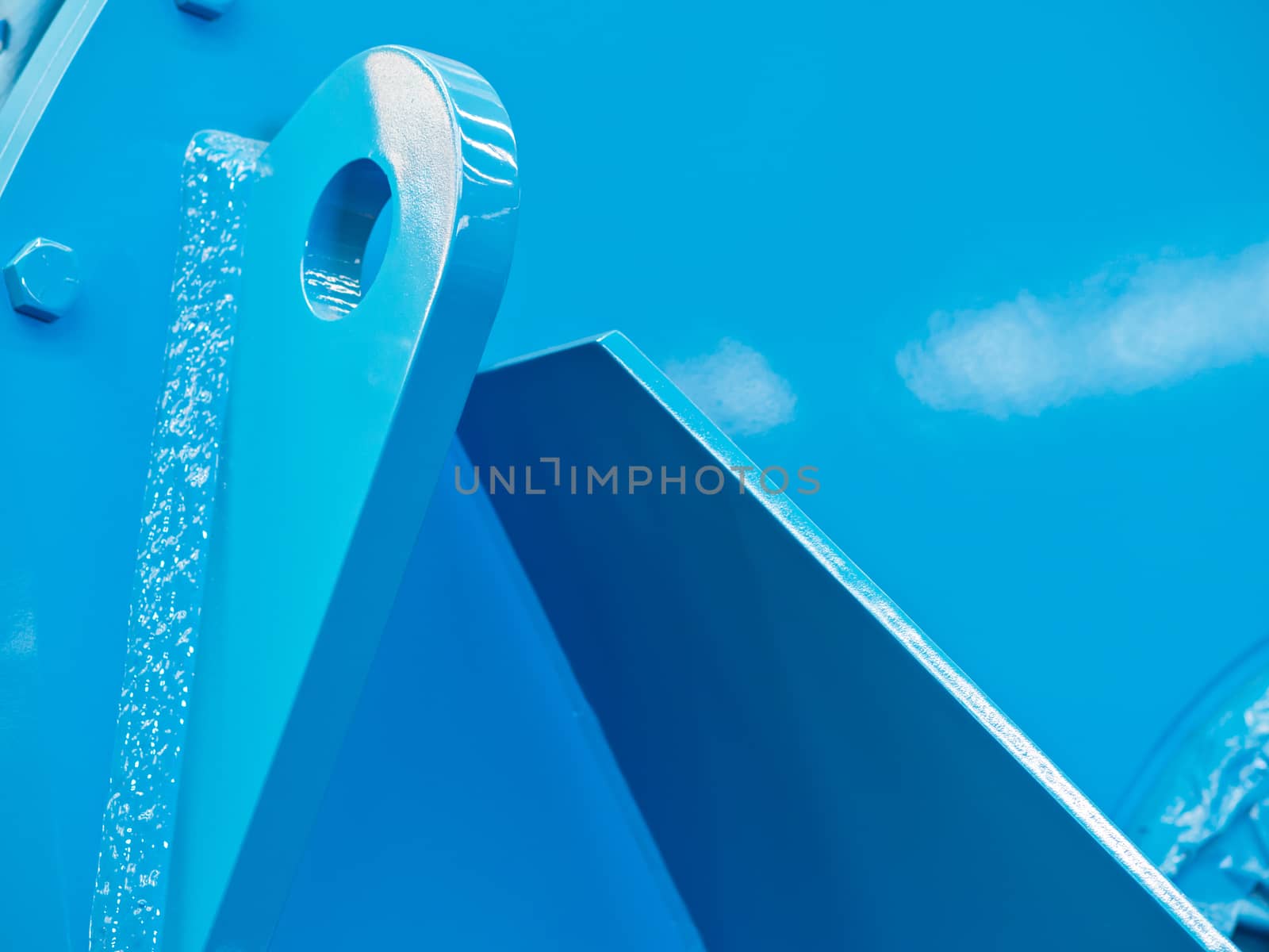 Abstract photograph of large, blue industrial component.
