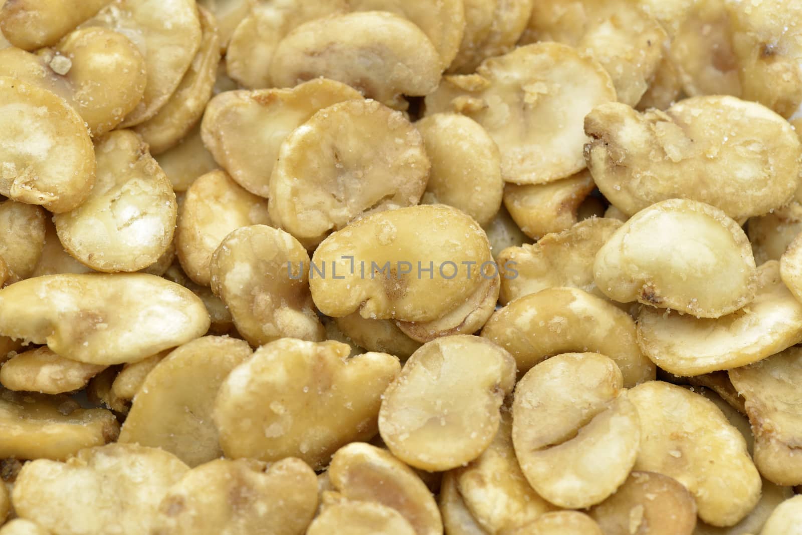 Close-up of roasted broad beans to use as background, also called horse beans

