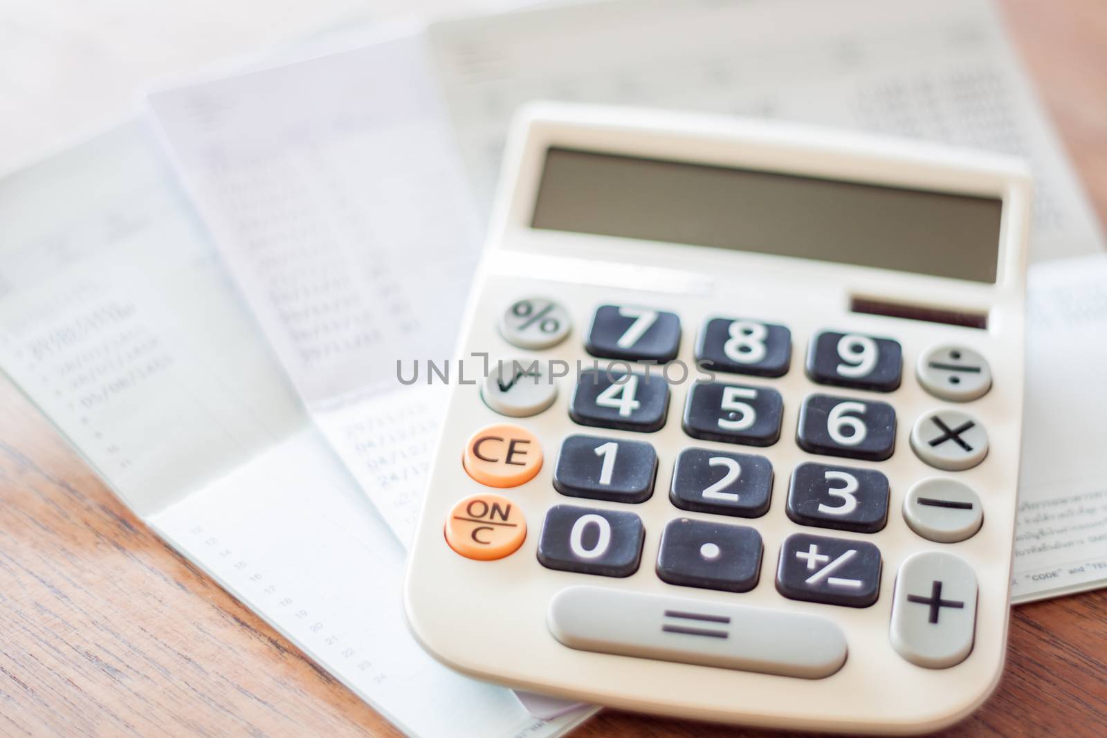 Calculator and bank account passbook, stock photo