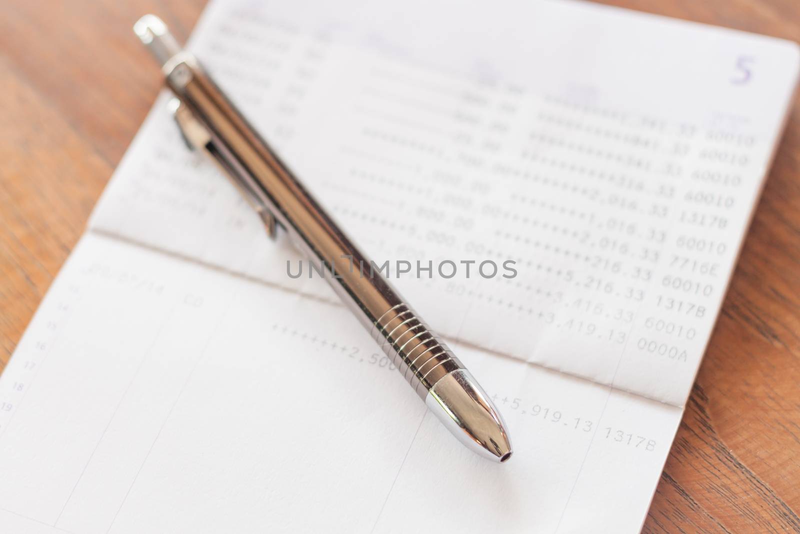 Bank account passbook with pen, stock photo