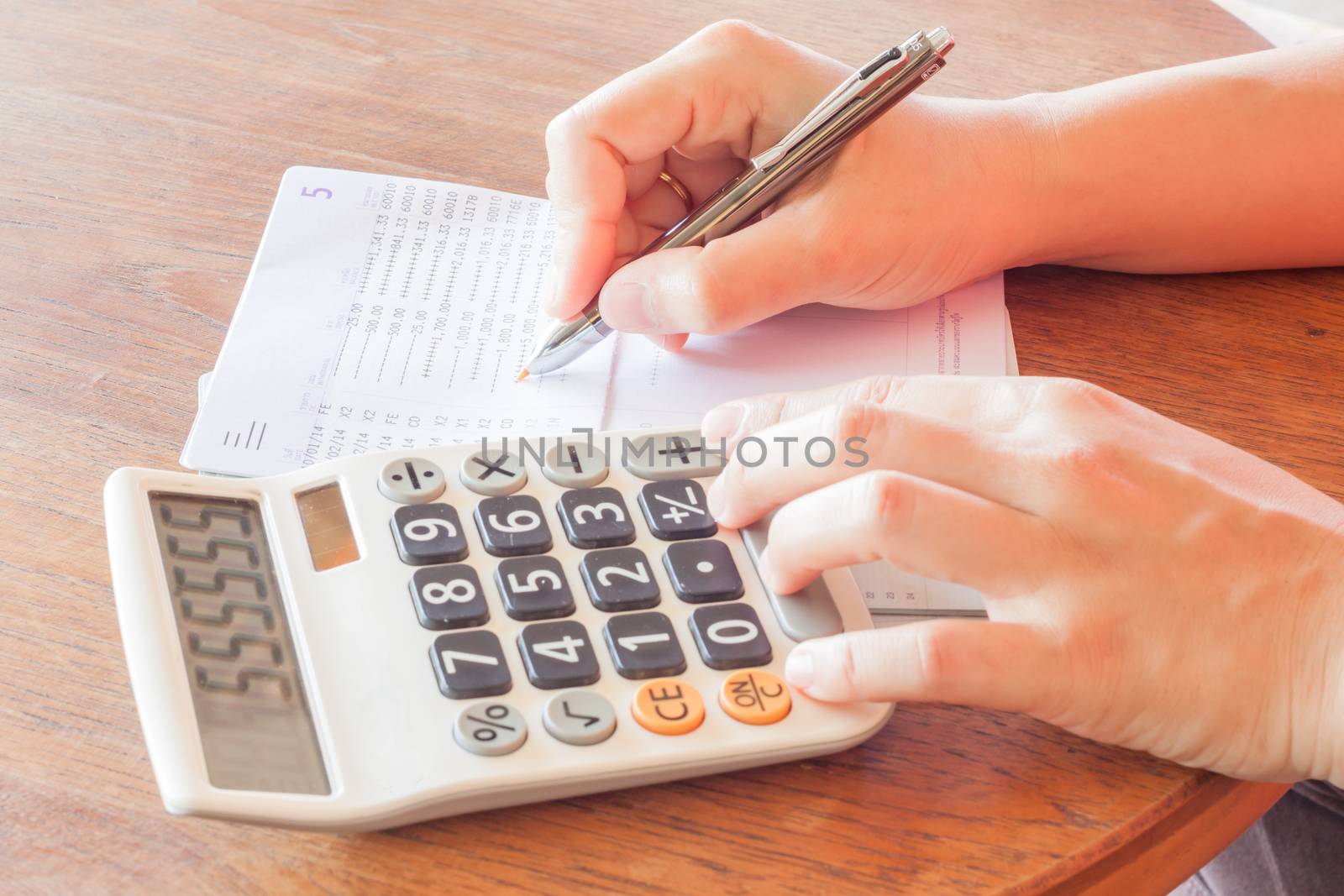 Businesswoman check bank account passbook, stock photo