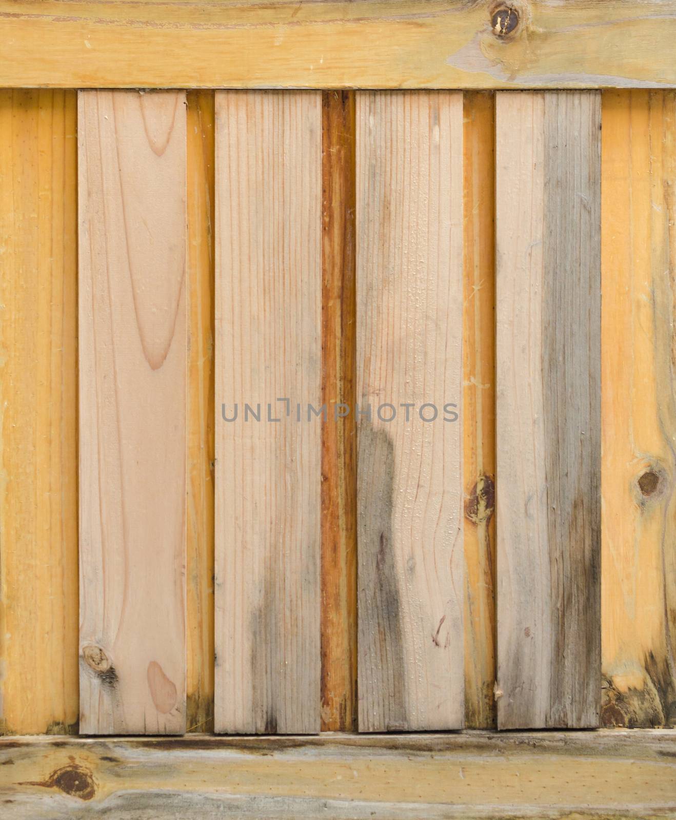 Close up of gray wooden fence panels by nopparats