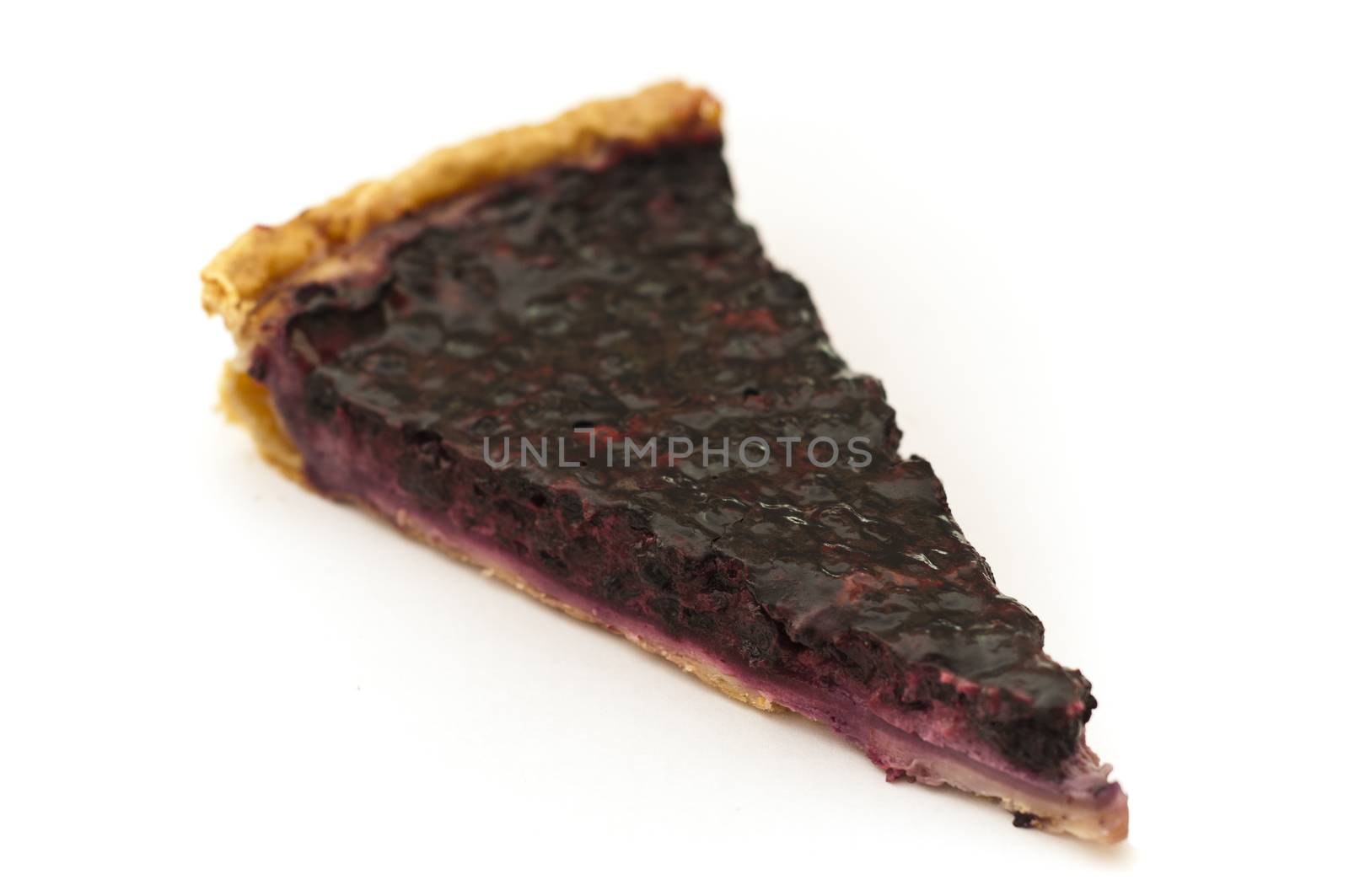 blueberries tart isolated on white background by NeydtStock