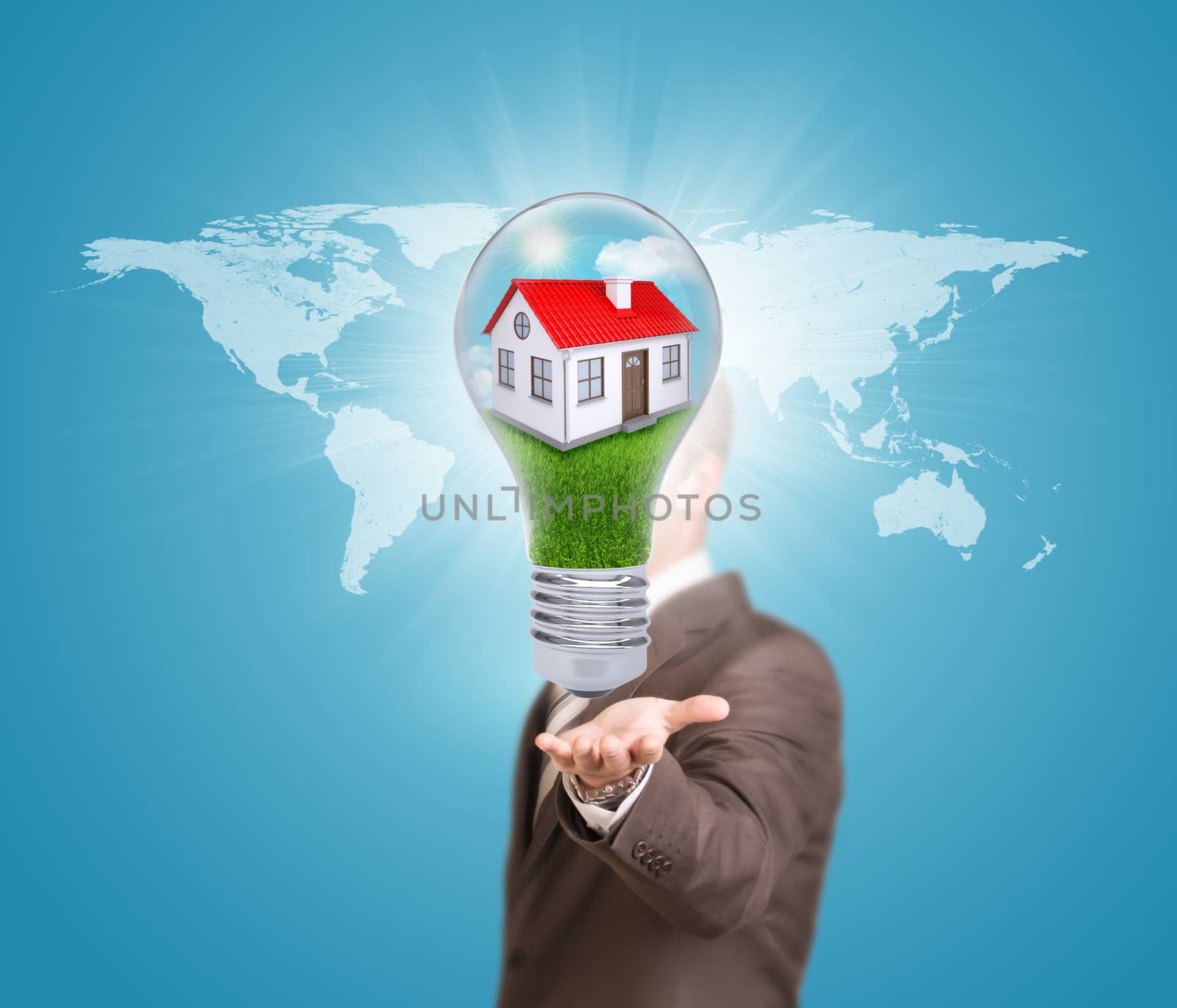 World map. Businessman in a suit hold bulb with house