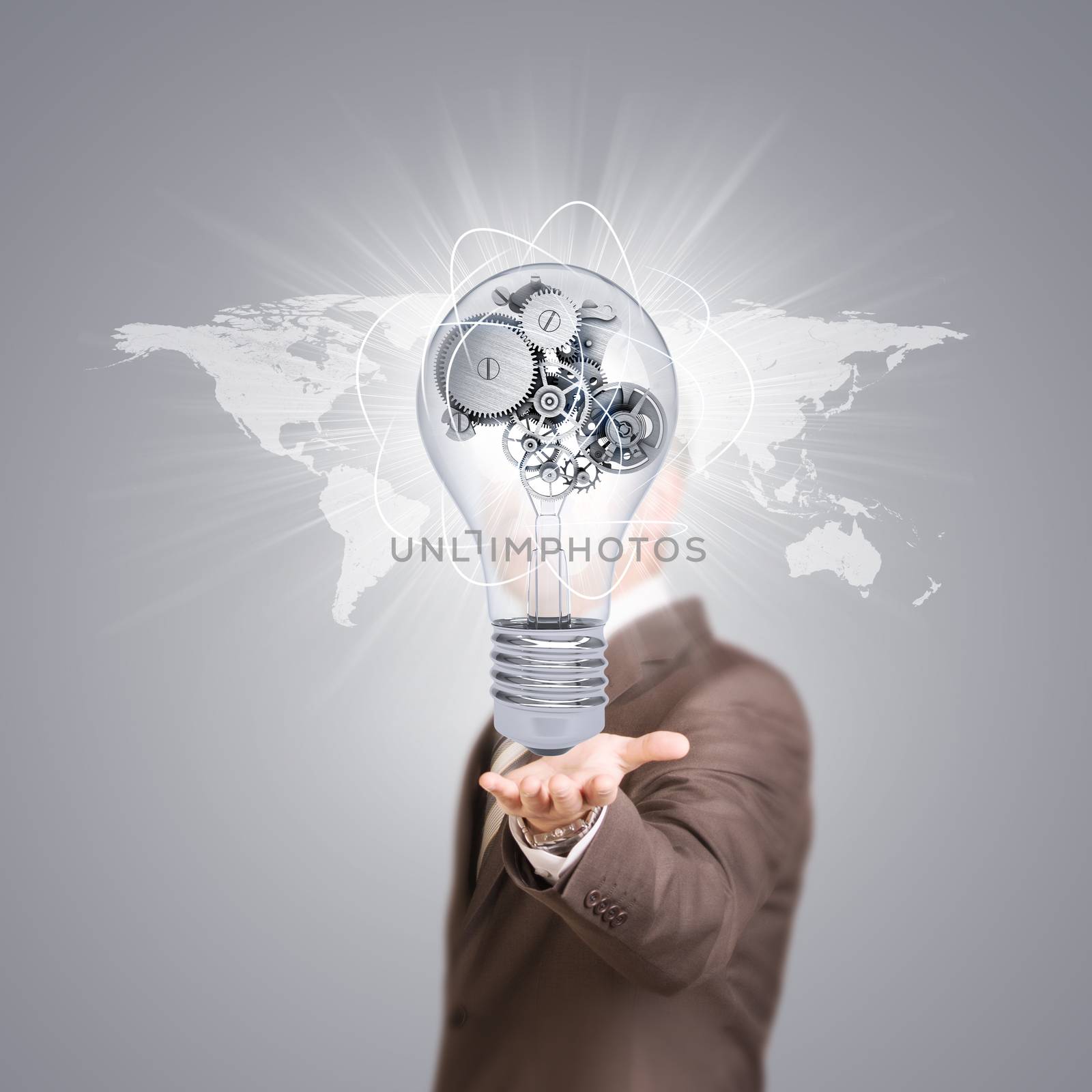 Businessman in a suit hold bulb with metal gears by cherezoff