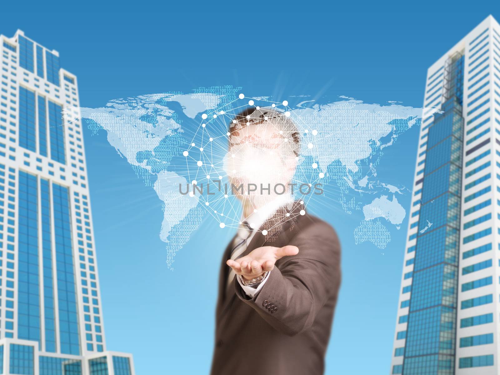 Skyscrapers. Businessman in a suit hold world map