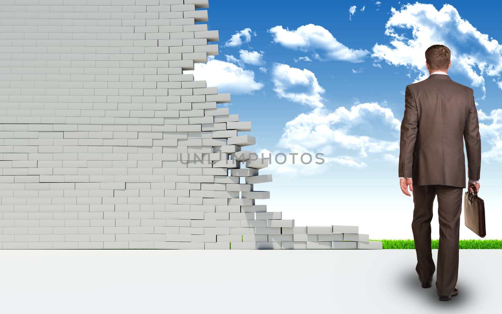 Businessman with briefcase goes through ruined brick wall. Green landscape as backdrop