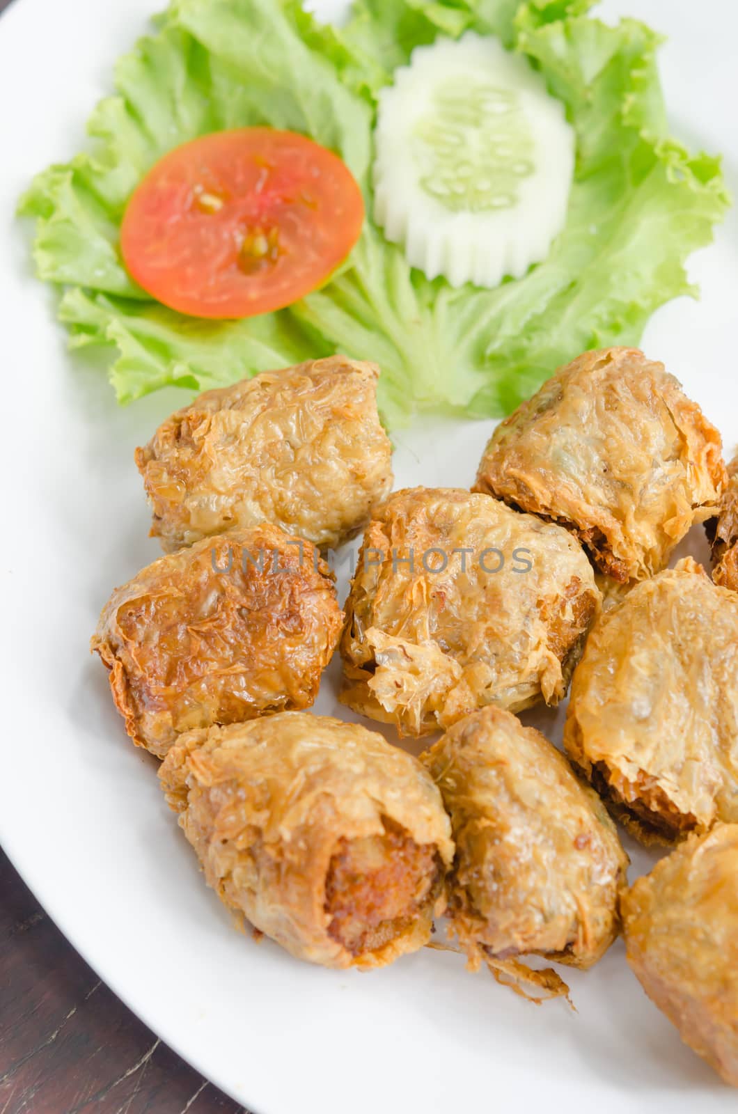 deep fried crab meat roll cake on white dish , chinese food