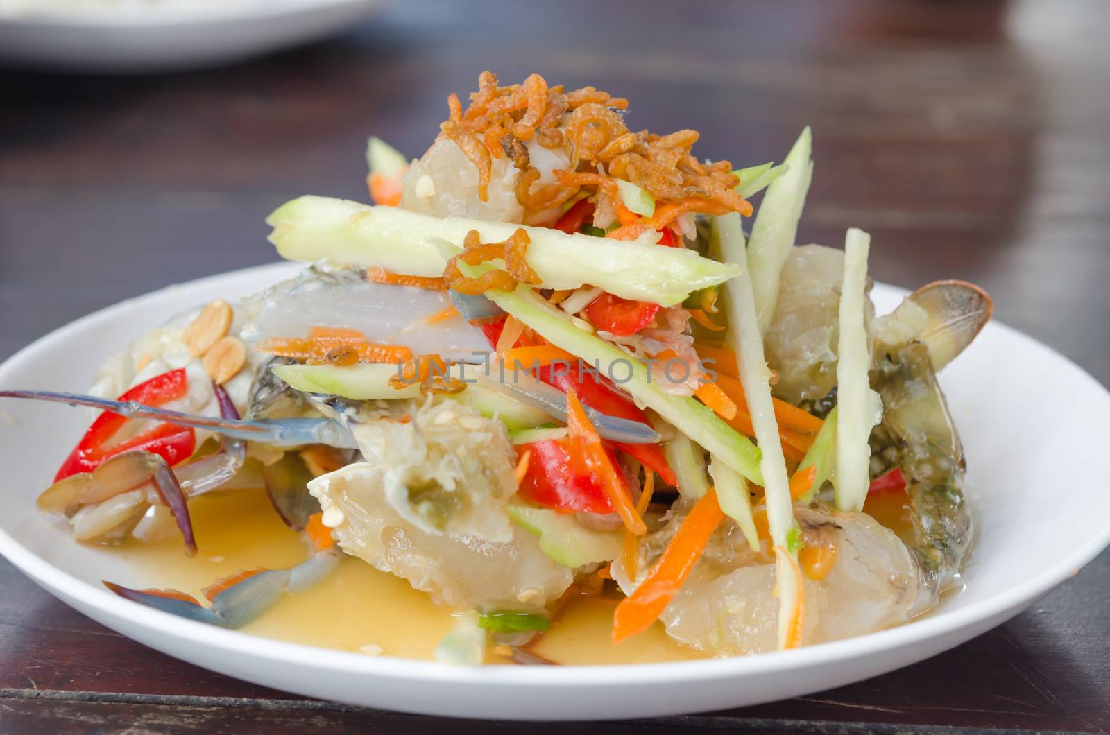 close up spicy mango salad with  crab , asian style food