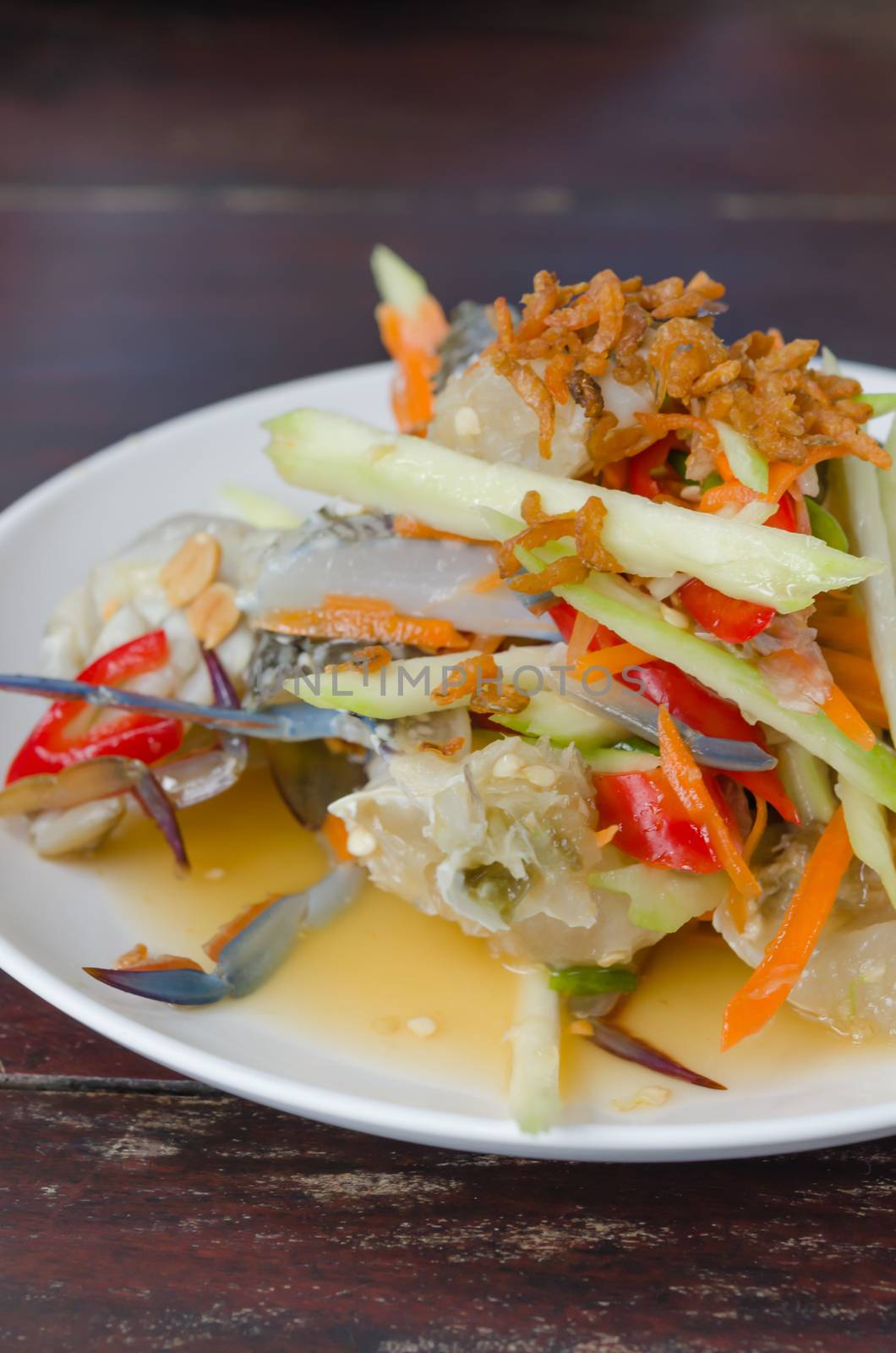 spicy mango salad with raw  crab , asian style food