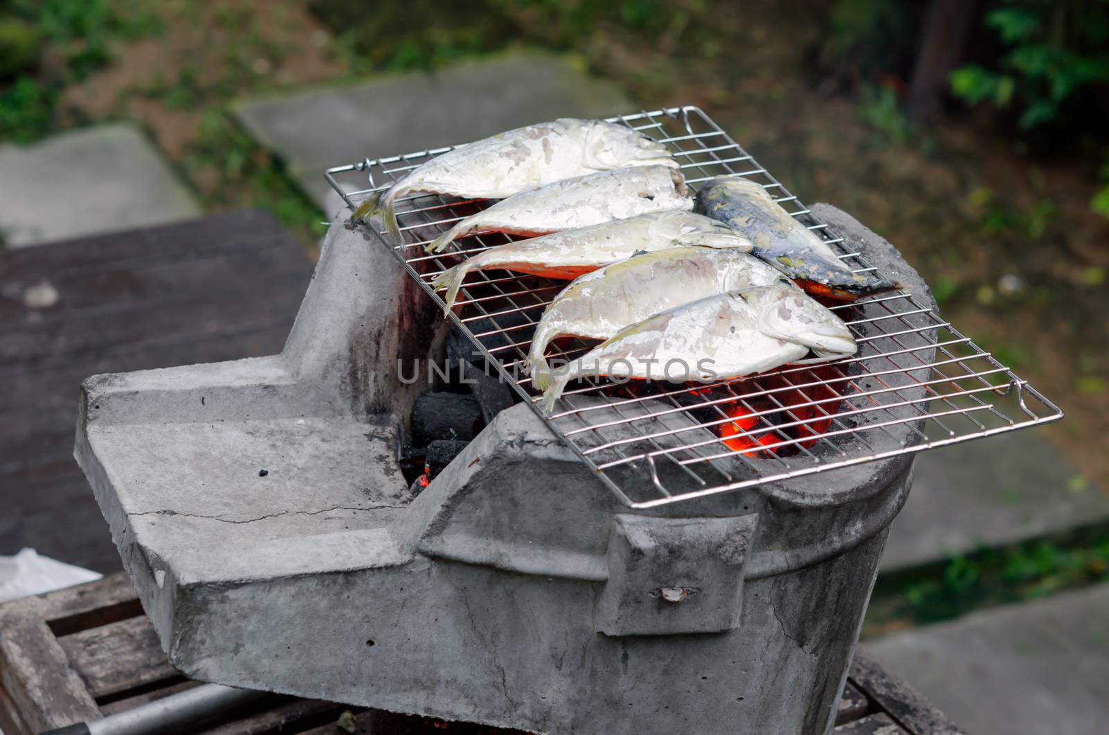 grill mackerel fish on  asian stove