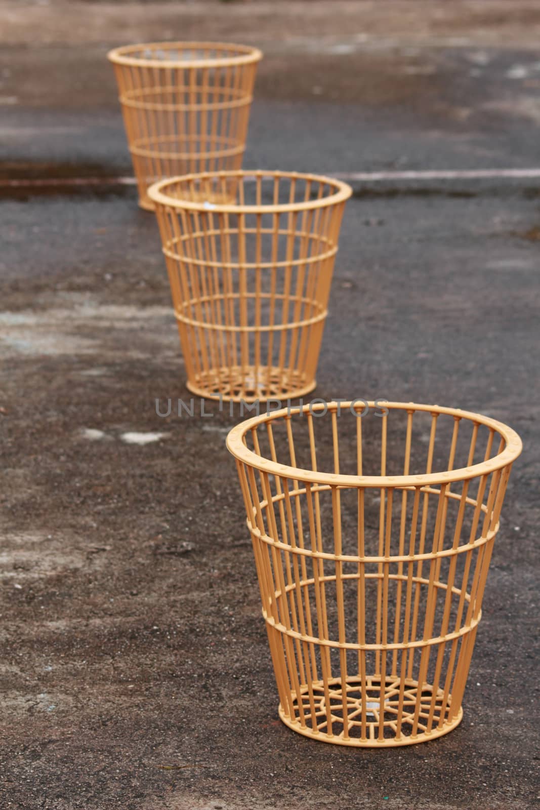 The baskets are arrange on the wet stadium.