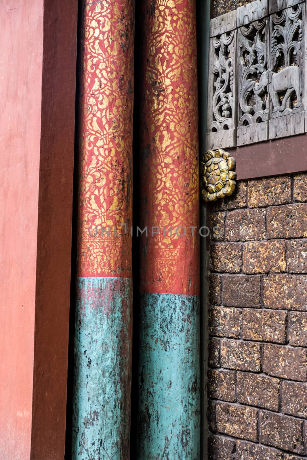 red asian style pillars in Thai pavilion