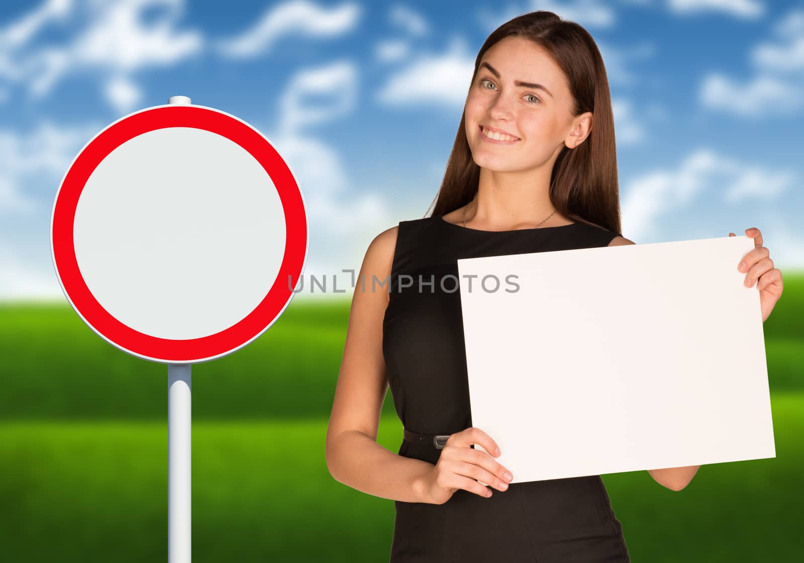 Businesswoman holding paper sheet. Road sign with landscape as backdrop